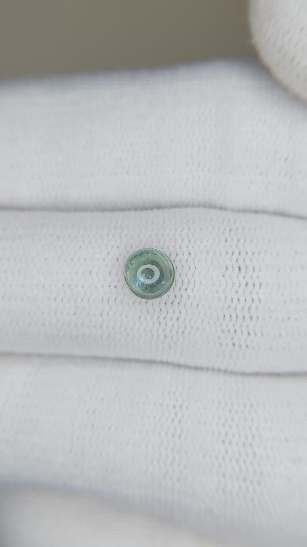 0.73 Ct. Bluish Green Cabochon Sapphire from Montana Size Video
