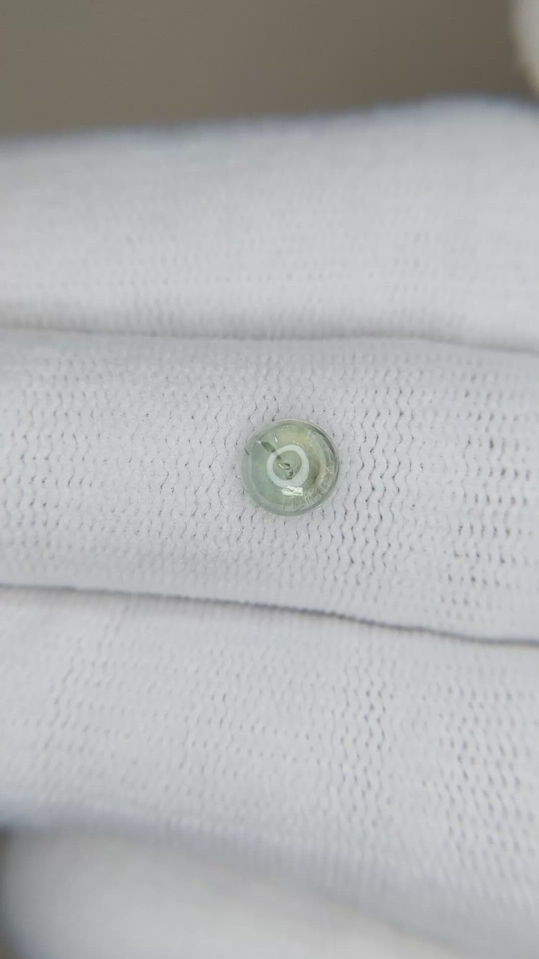 0.74 Ct. Yellowish Green Cabochon Sapphire from Montana Size Video