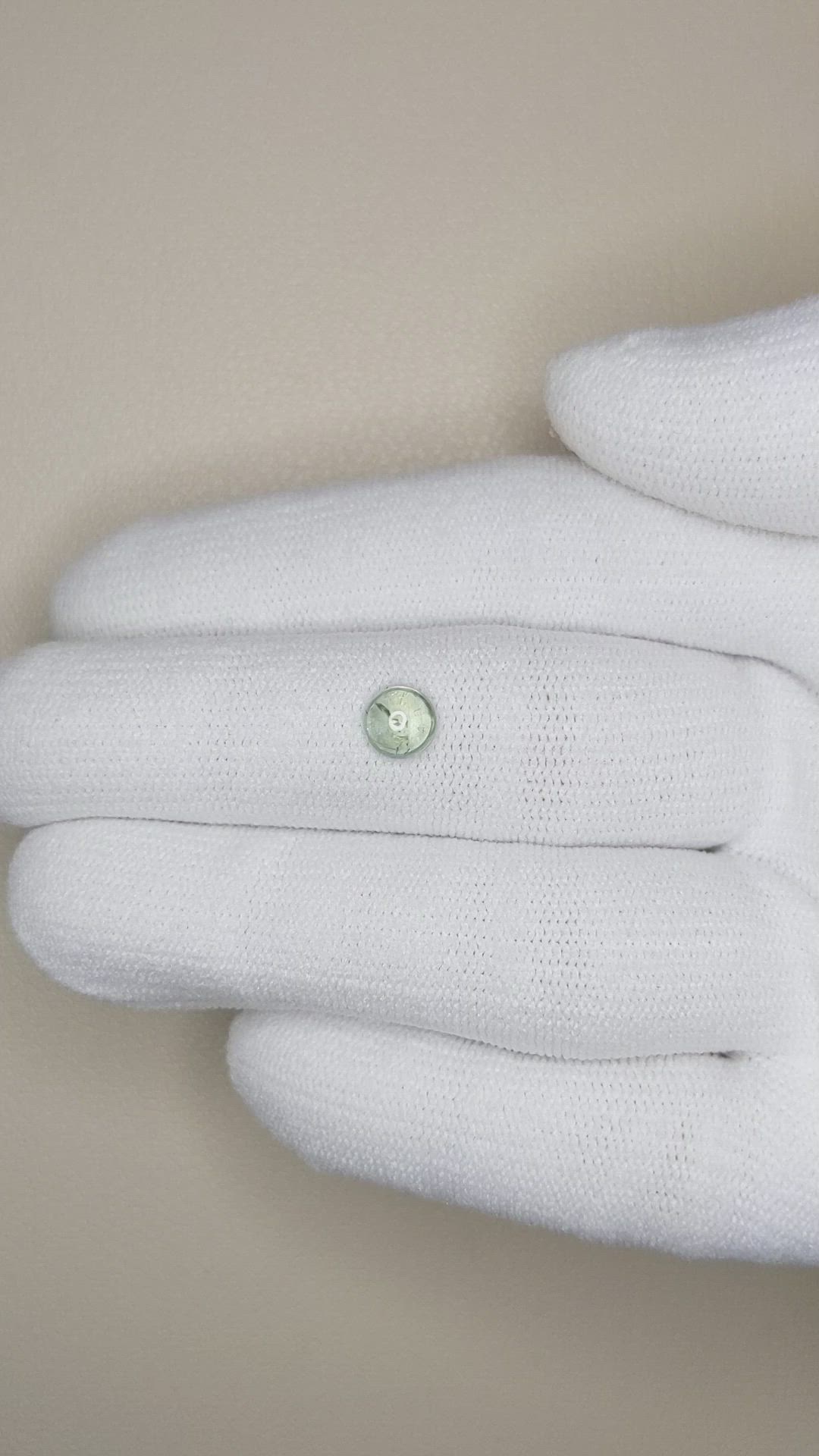 0.74 Ct. Yellowish Green Cabochon Sapphire from Montana Size Video