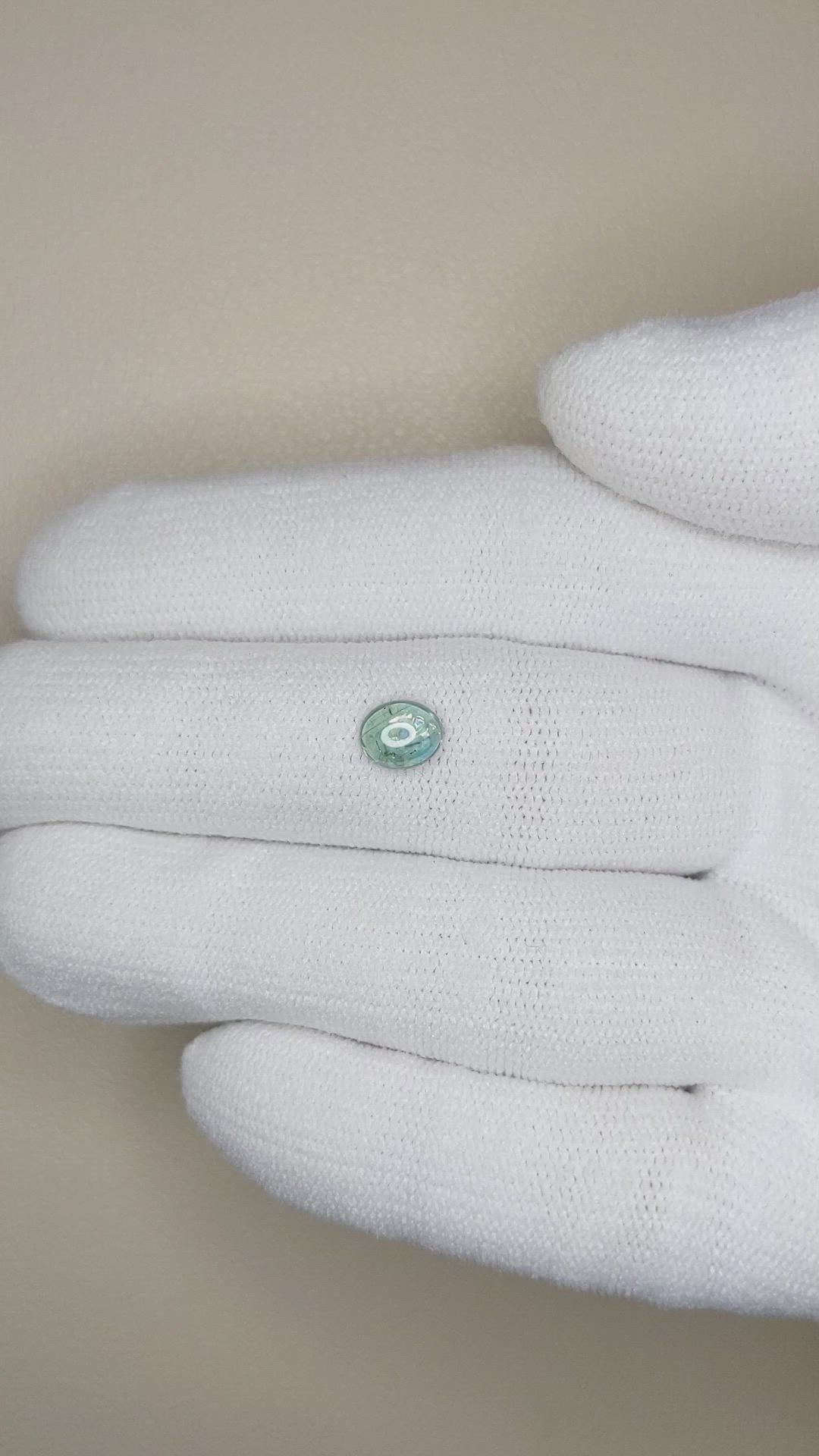 0.84 Ct. Bluish Green Cabochon Sapphire from Montana Size Video