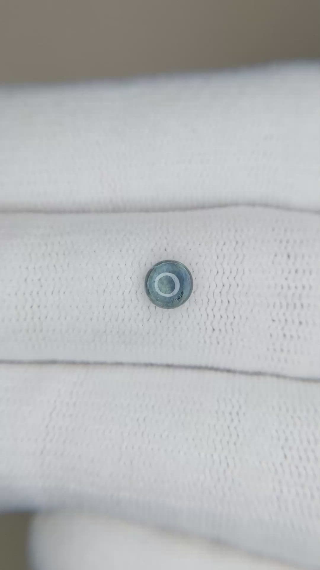 0.59 Ct. Bluish Green Cabochon Sapphire from Montana Size Video