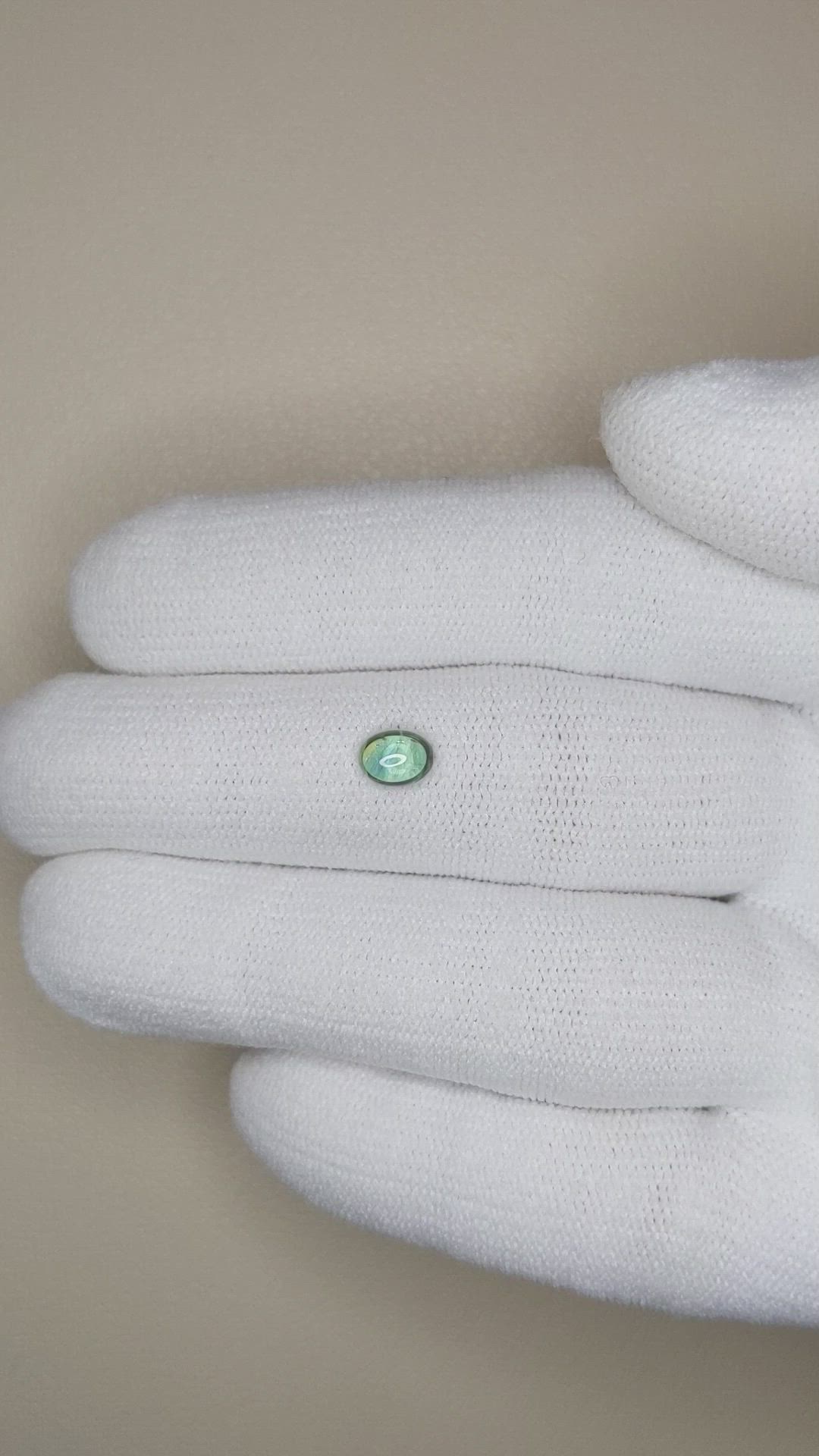 0.60 Ct. Yellowish Green Cabochon Sapphire from Montana Size Video