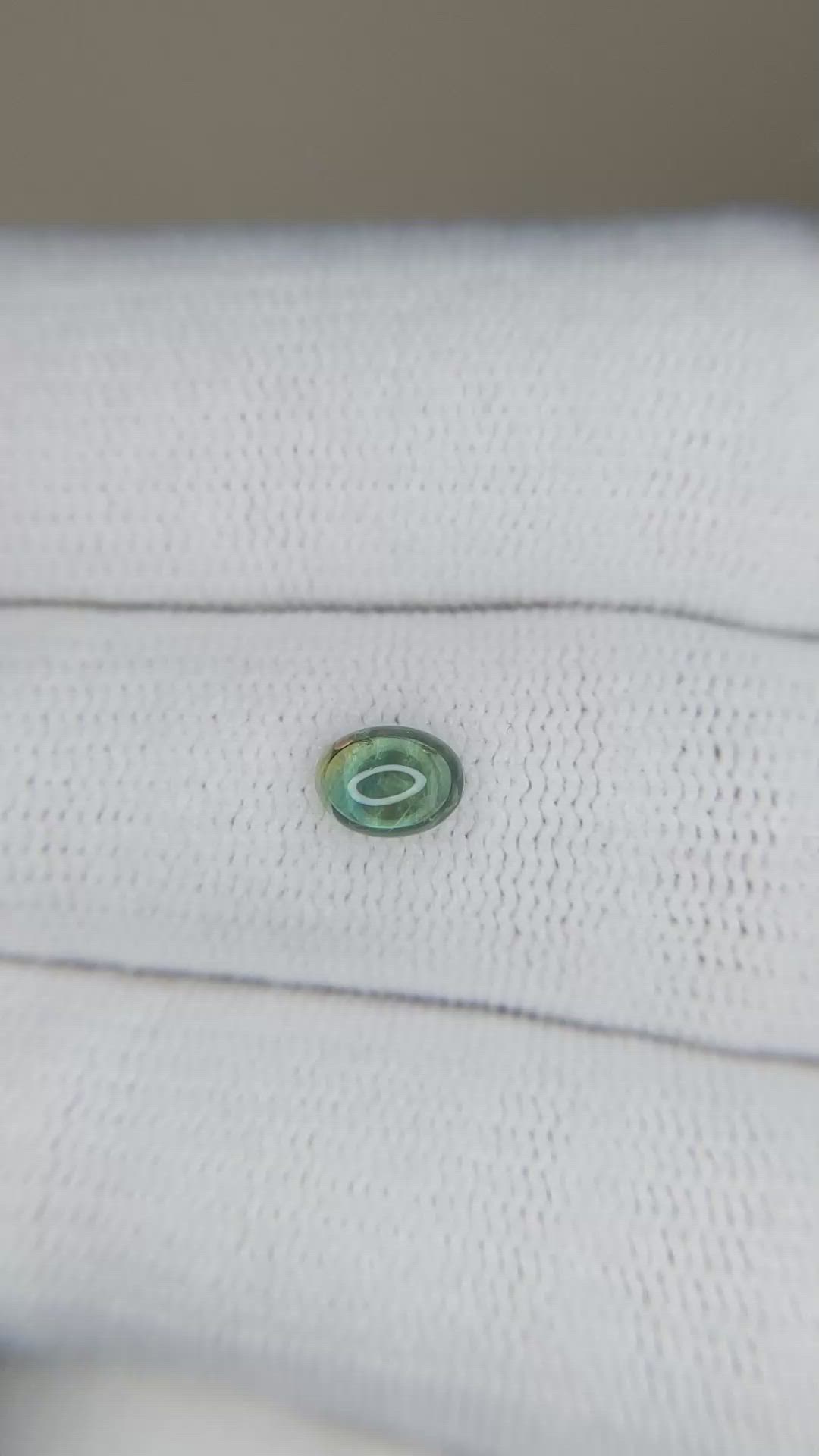 0.60 Ct. Yellowish Green Cabochon Sapphire from Montana Size Video