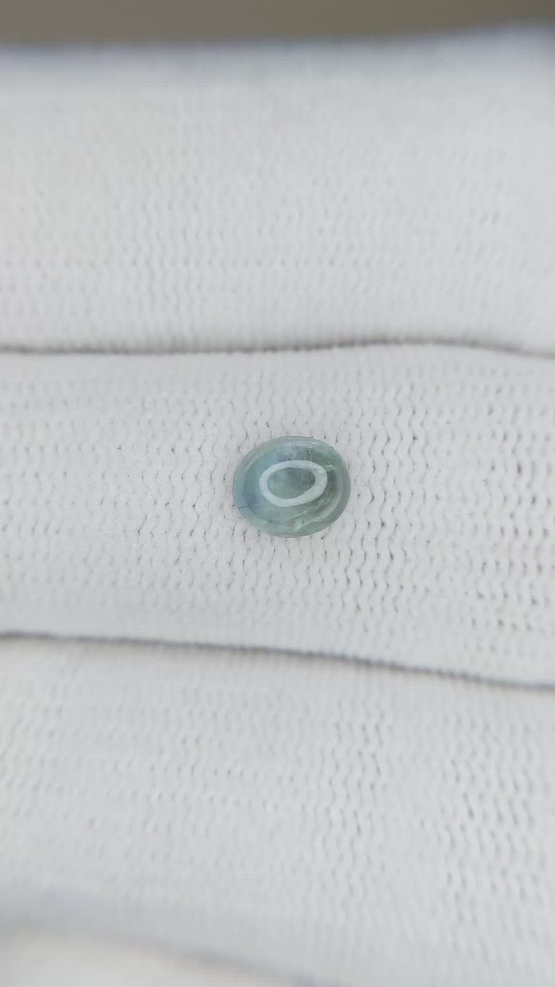 0.71 Ct. Bluish Green Cabochon Sapphire from Montana Size Video