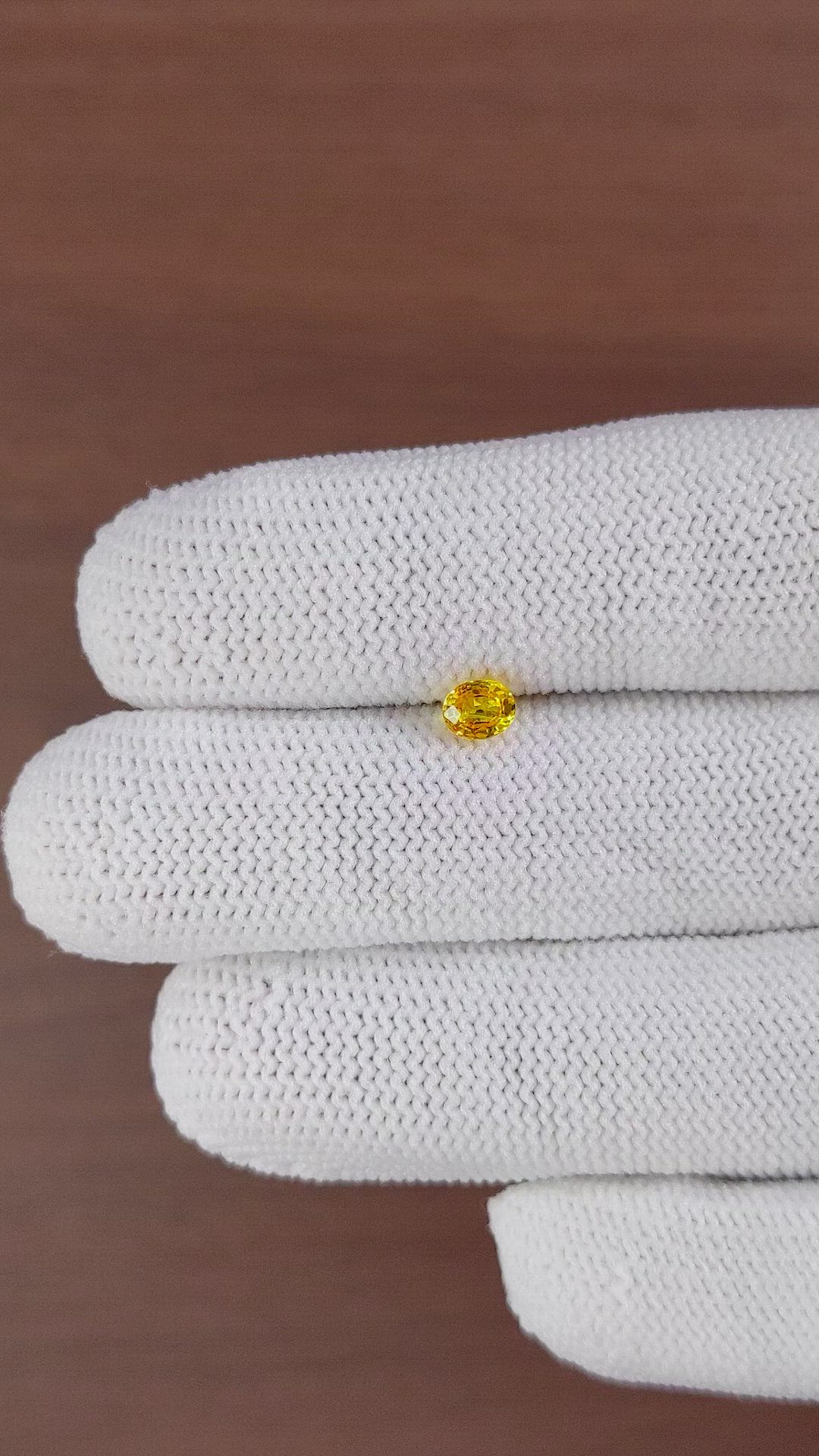 0.49 Ct. Orangish Yellow Sapphire from Ceylon (Sri Lanka) Size Video