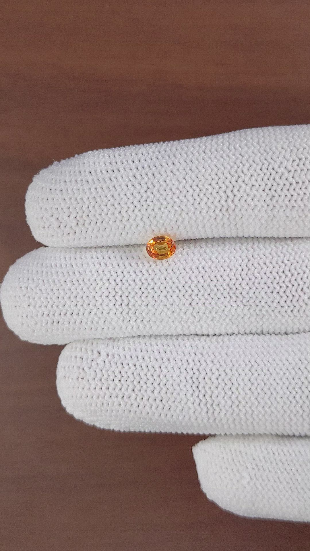 0.52 Ct. Orange Sapphire from Ceylon (Sri Lanka) Size Video