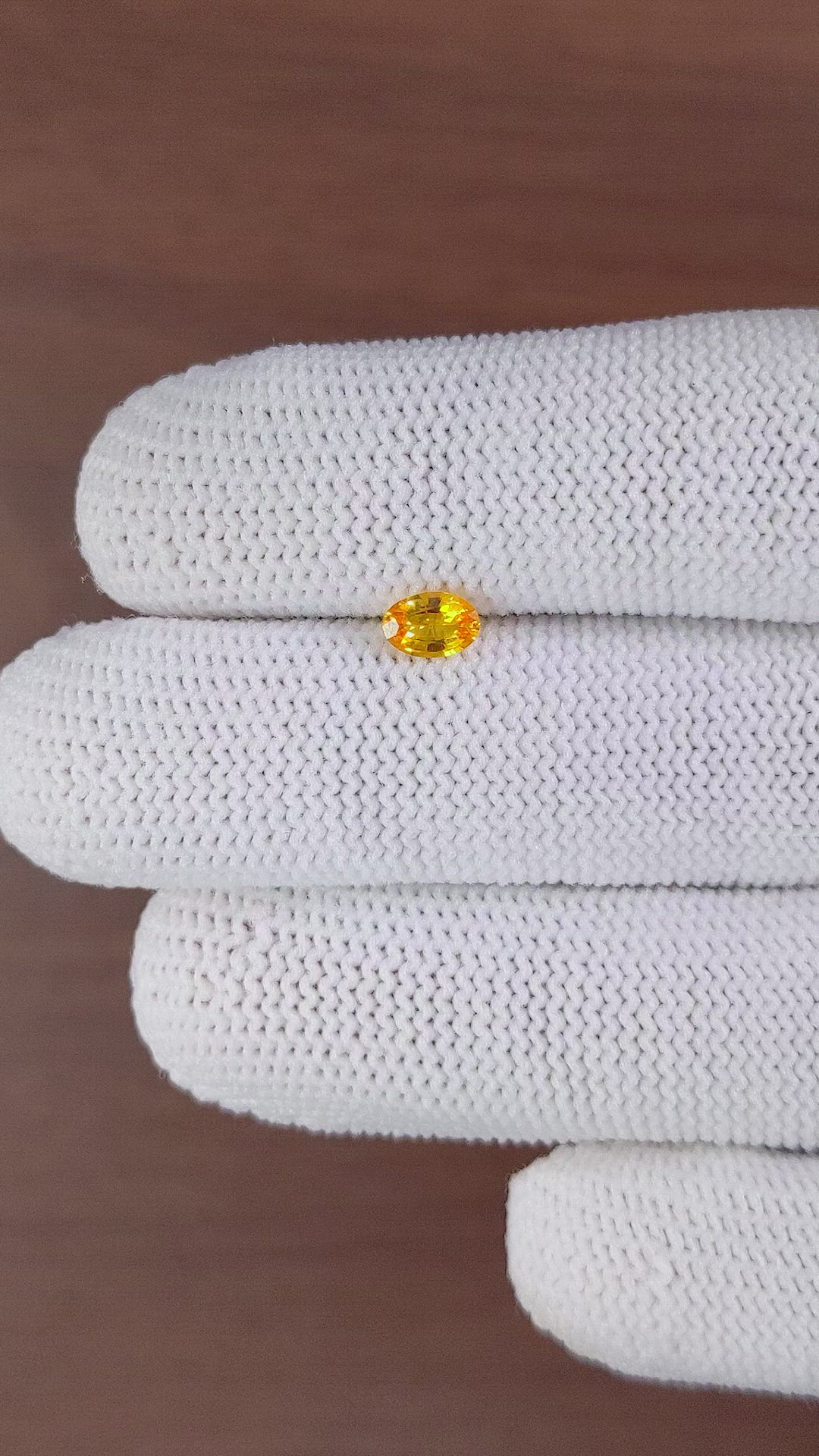0.45 Ct. Yellowish Orange Sapphire from Ceylon (Sri Lanka) Size Video