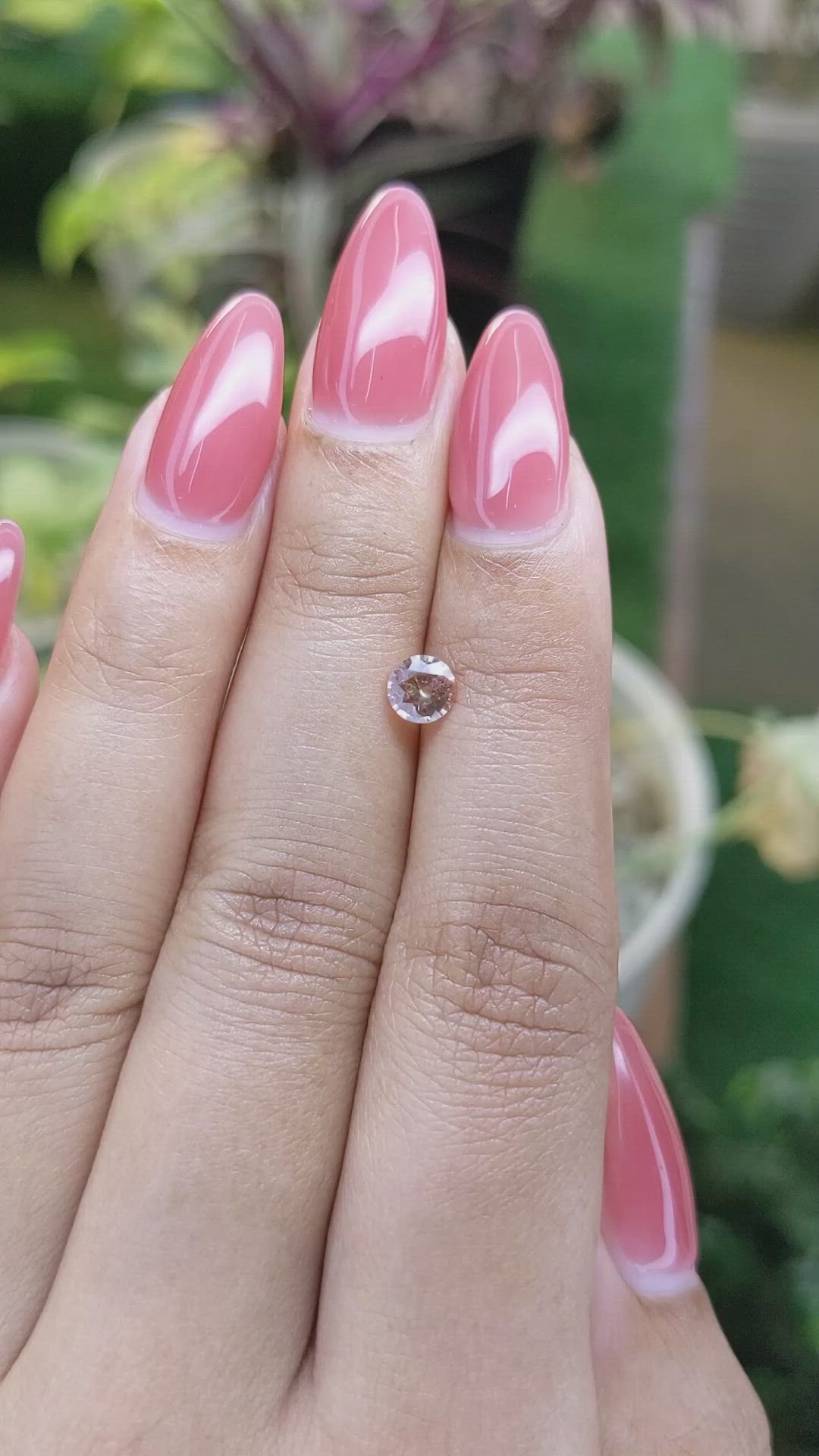 0.56 Ct. Peach Sapphire from Ceylon (Sri Lanka) Size Video