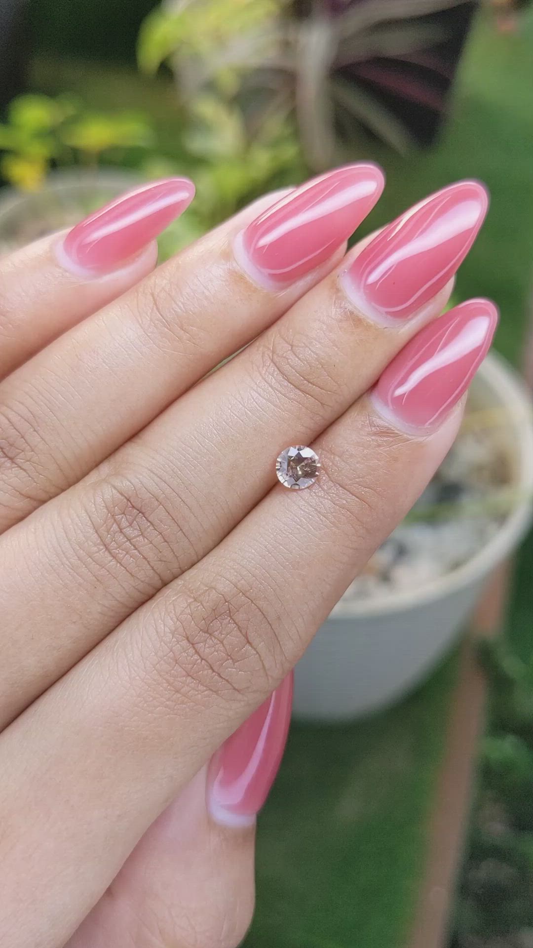 0.56 Ct. Peach Sapphire from Ceylon (Sri Lanka) Size Video