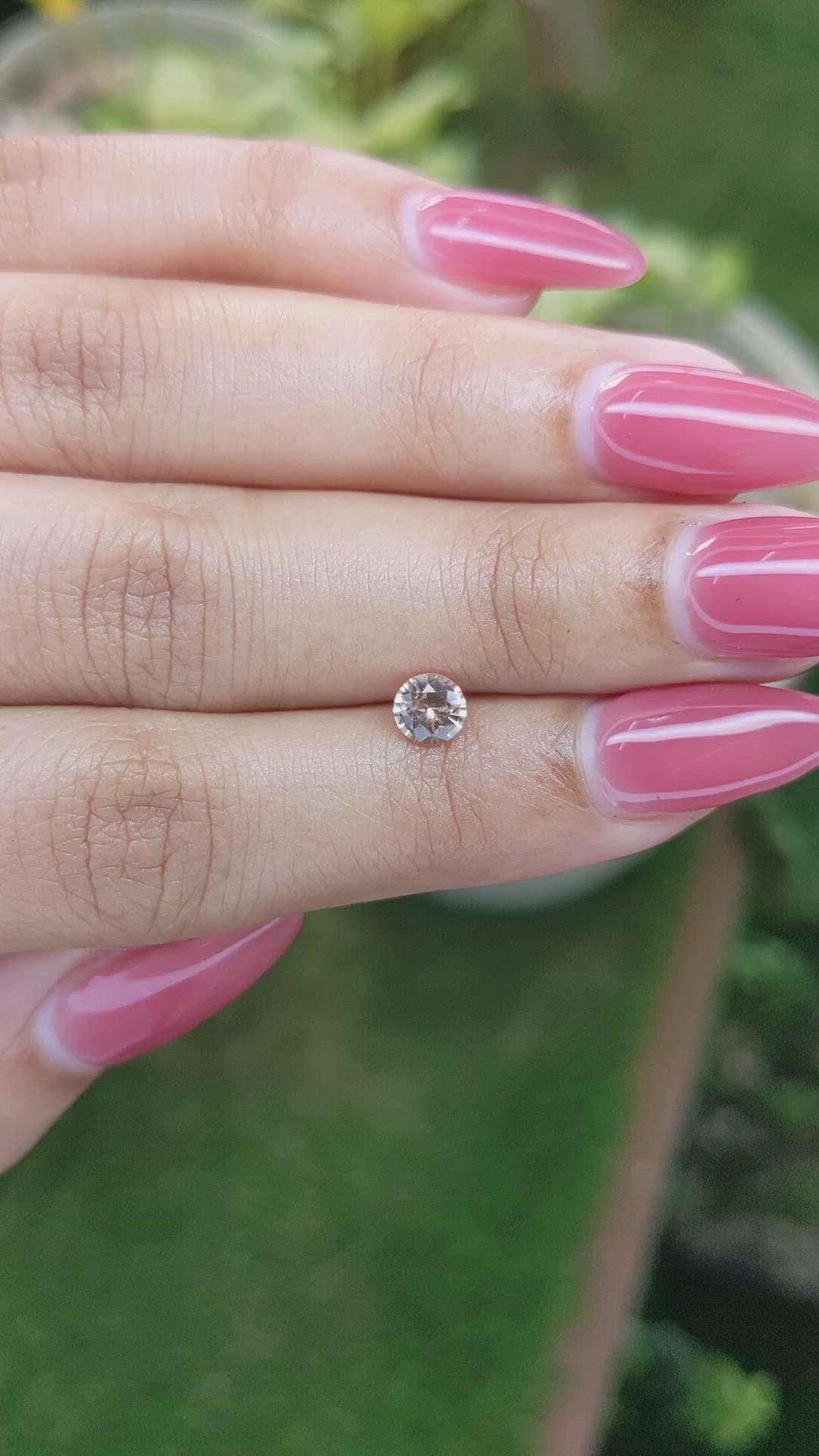 0.56 Ct. Peach Sapphire from Ceylon (Sri Lanka) Size Video