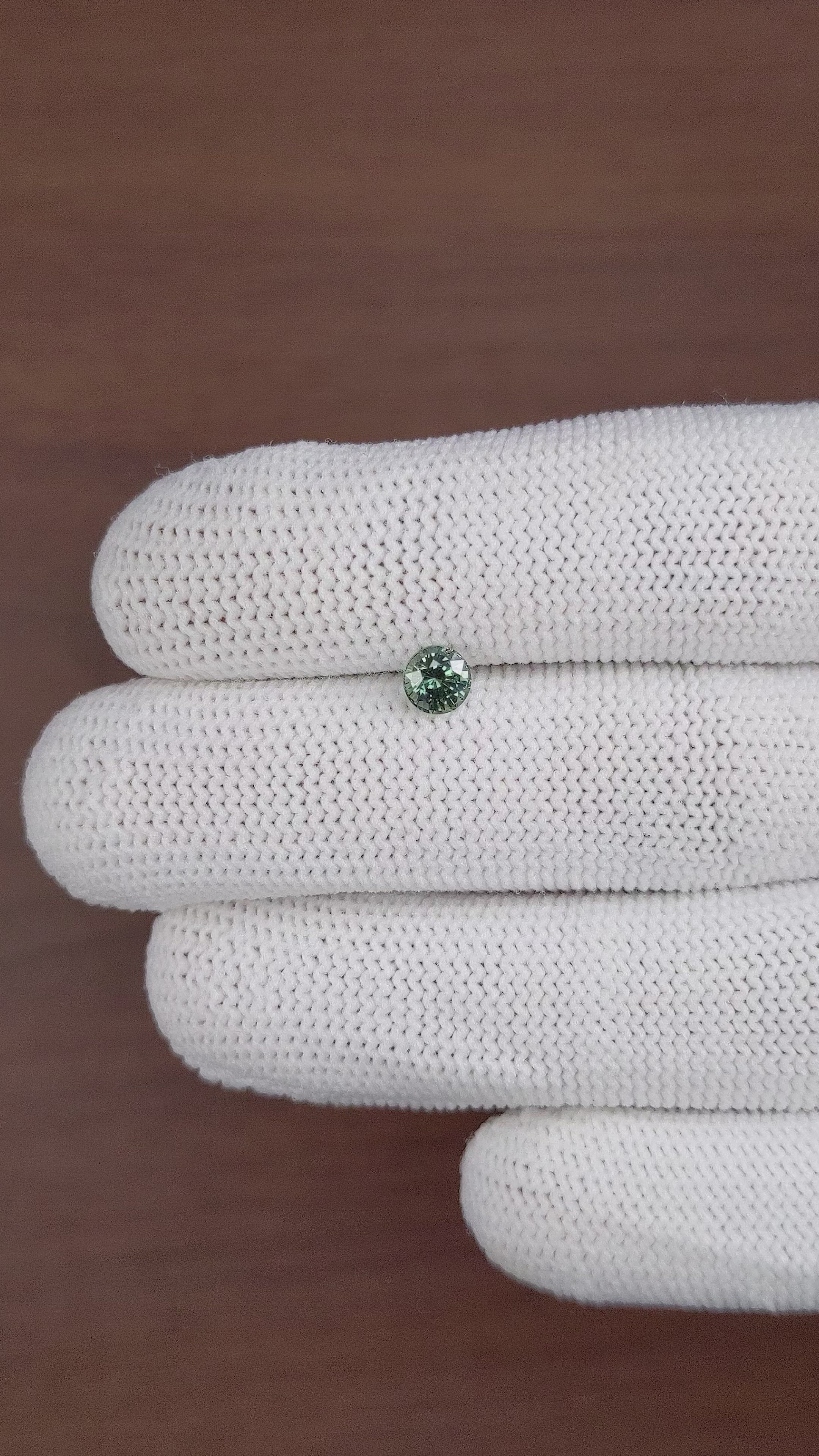 0.78 Ct. Bluish Green Sapphire from Madagascar Size Video