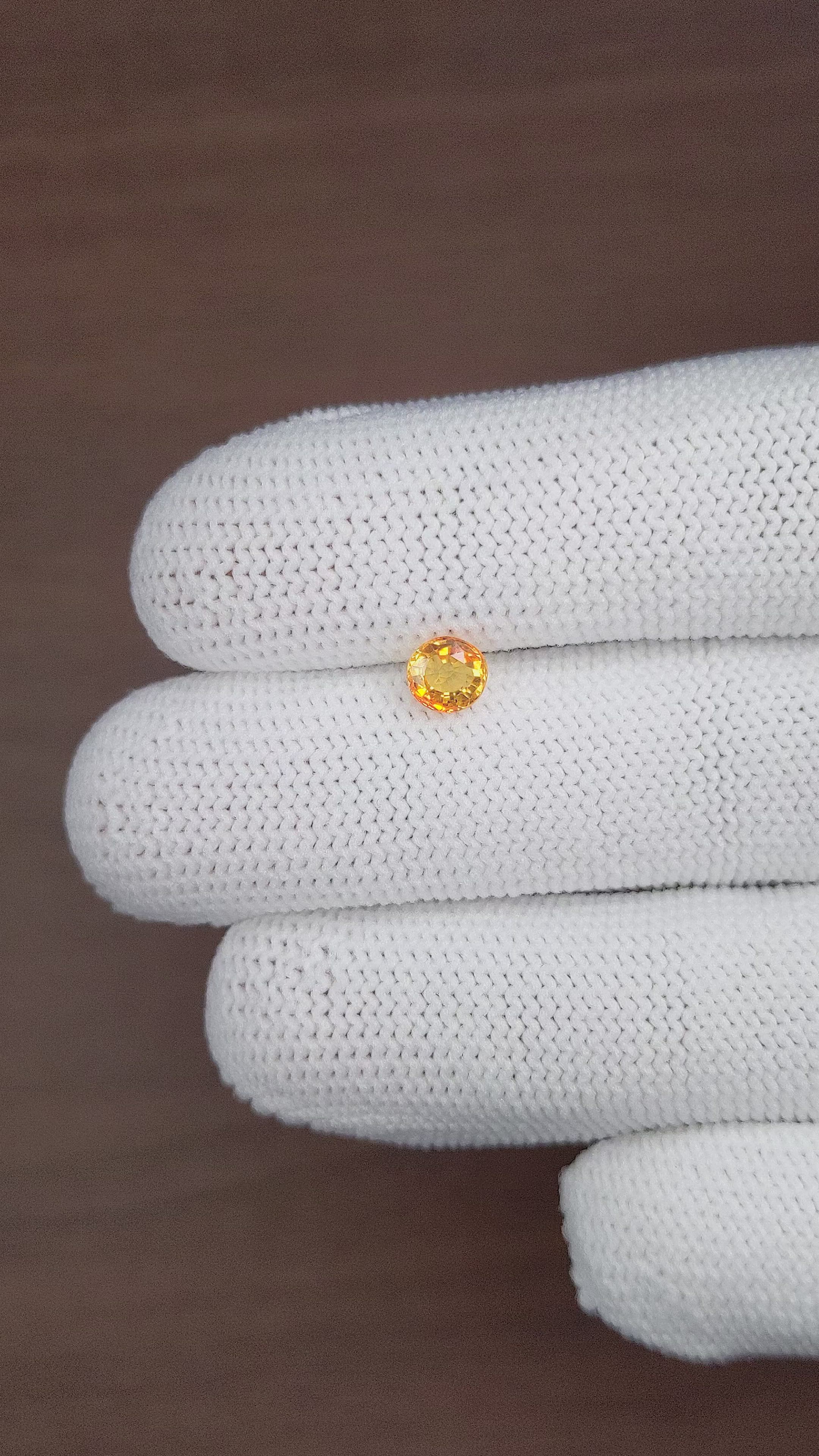 0.80 Ct. Orangish Yellow Sapphire from Madagascar Size Video