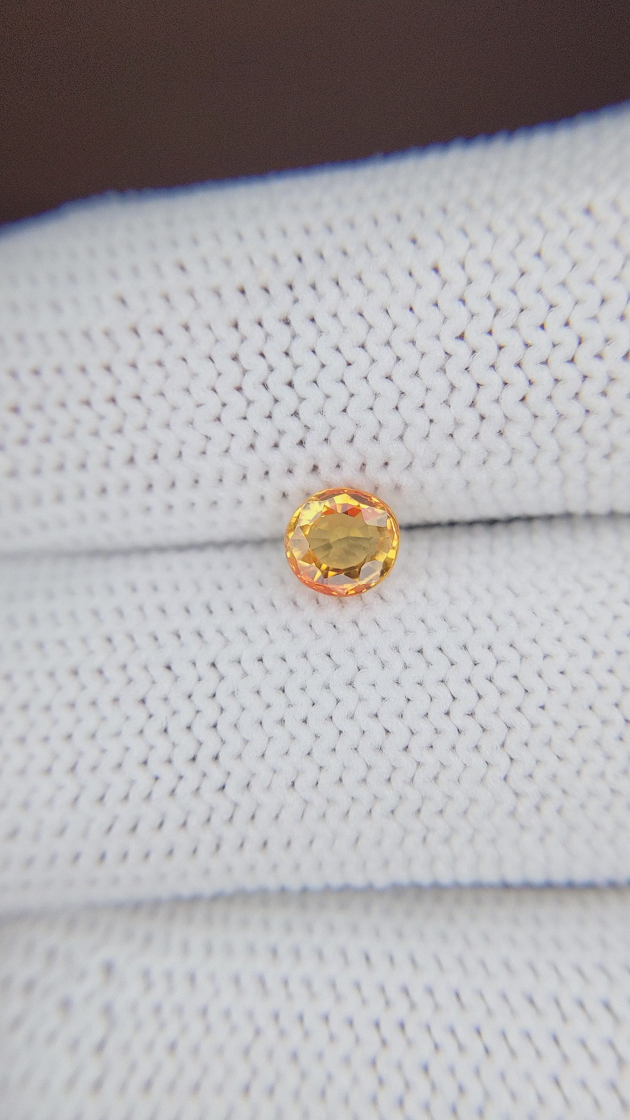 0.80 Ct. Orangish Yellow Sapphire from Madagascar Size Video