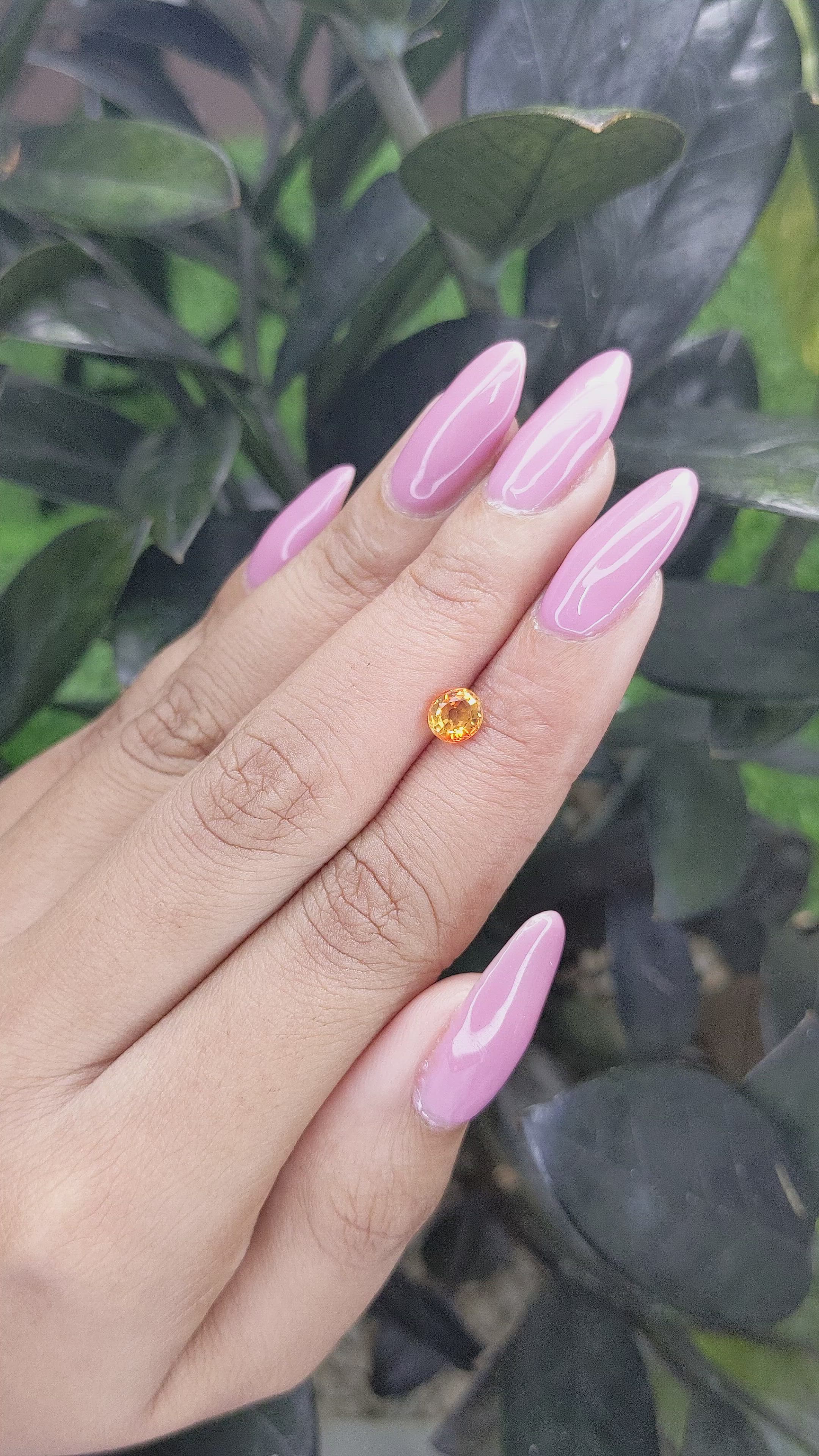 0.80 Ct. Orangish Yellow Sapphire from Madagascar Size Video