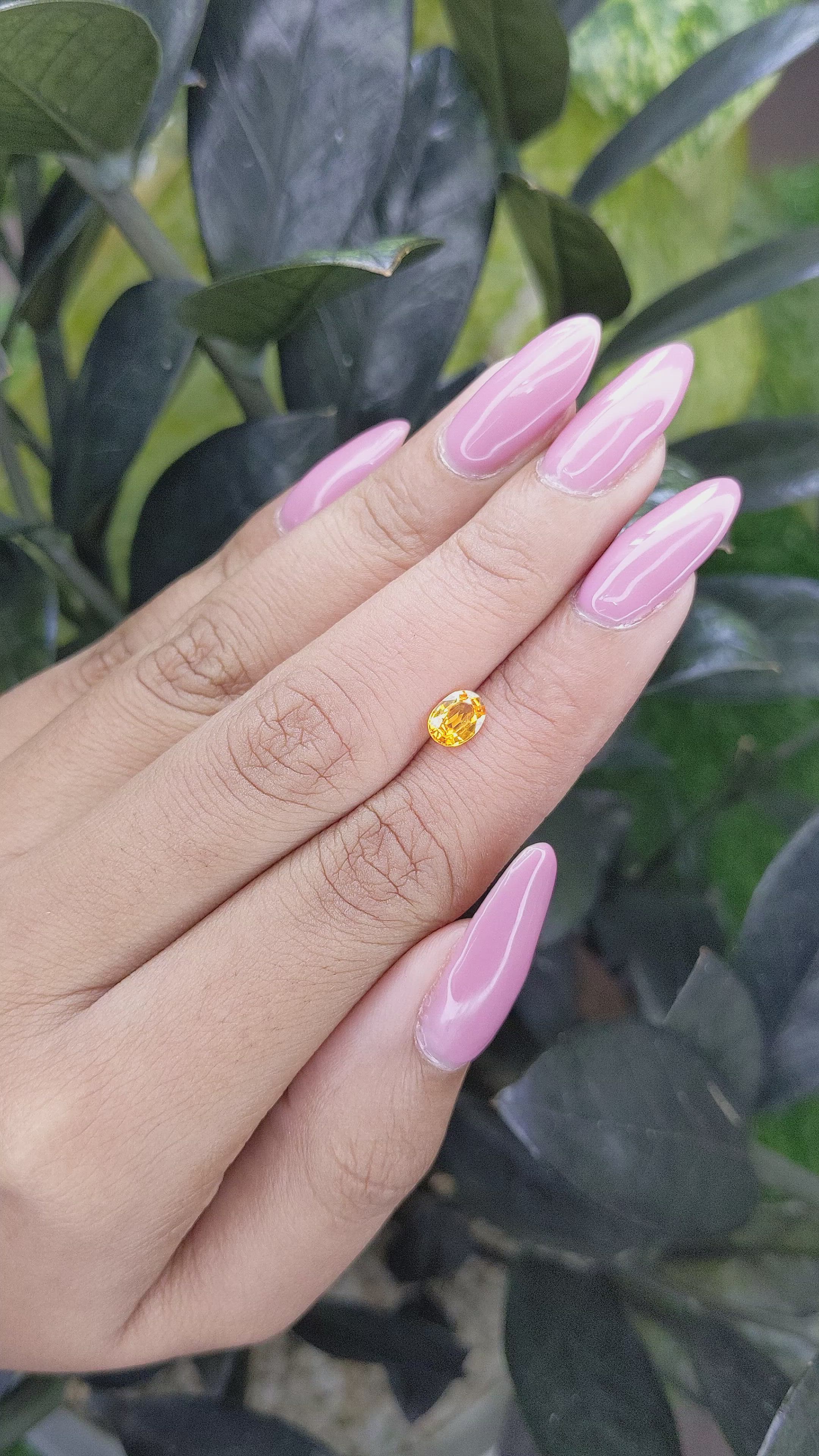 0.69 Ct. Orangish Yellow Sapphire from Madagascar Size Video