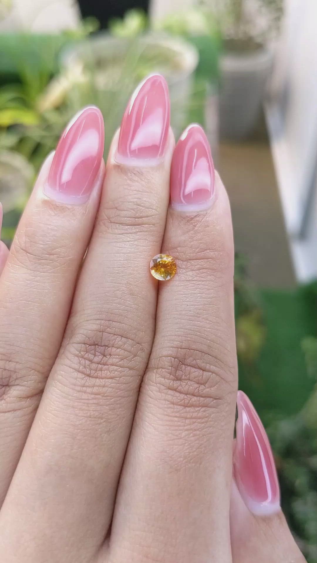 0.58 Ct. Yellowish Orange Sapphire from Ceylon (Sri Lanka) Size Video