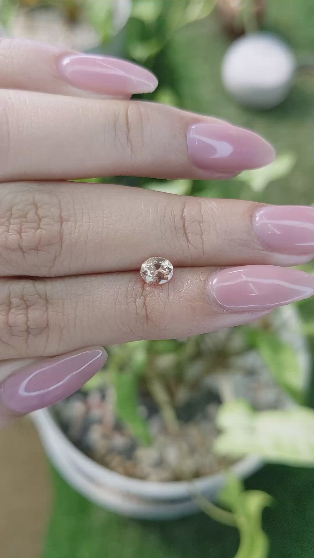 0.58 Ct. Peach Sapphire from Ceylon (Sri Lanka) Size Video