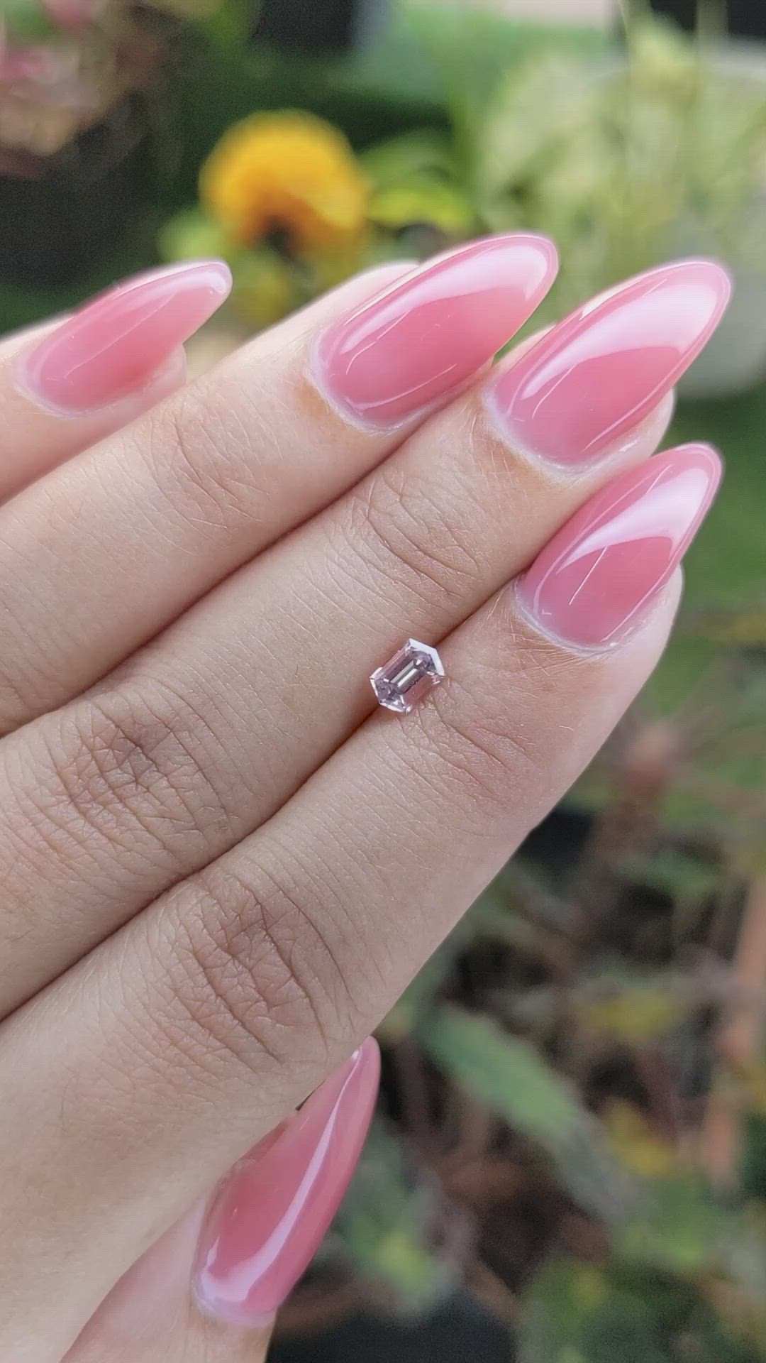 0.56 Ct. Peach Sapphire from Ceylon (Sri Lanka) Size Video