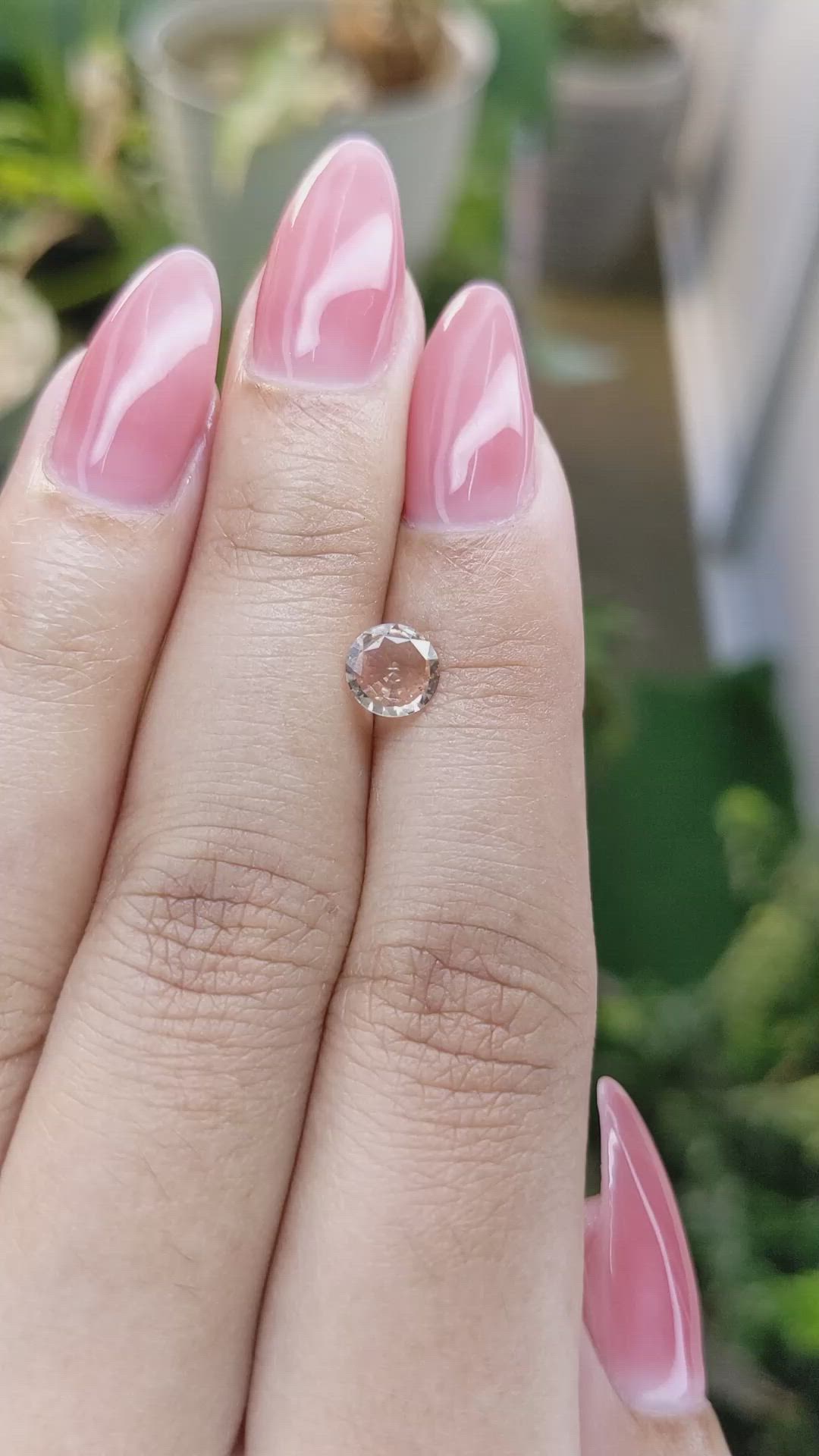 0.71 Ct. Peach Sapphire from Ceylon (Sri Lanka) Size Video