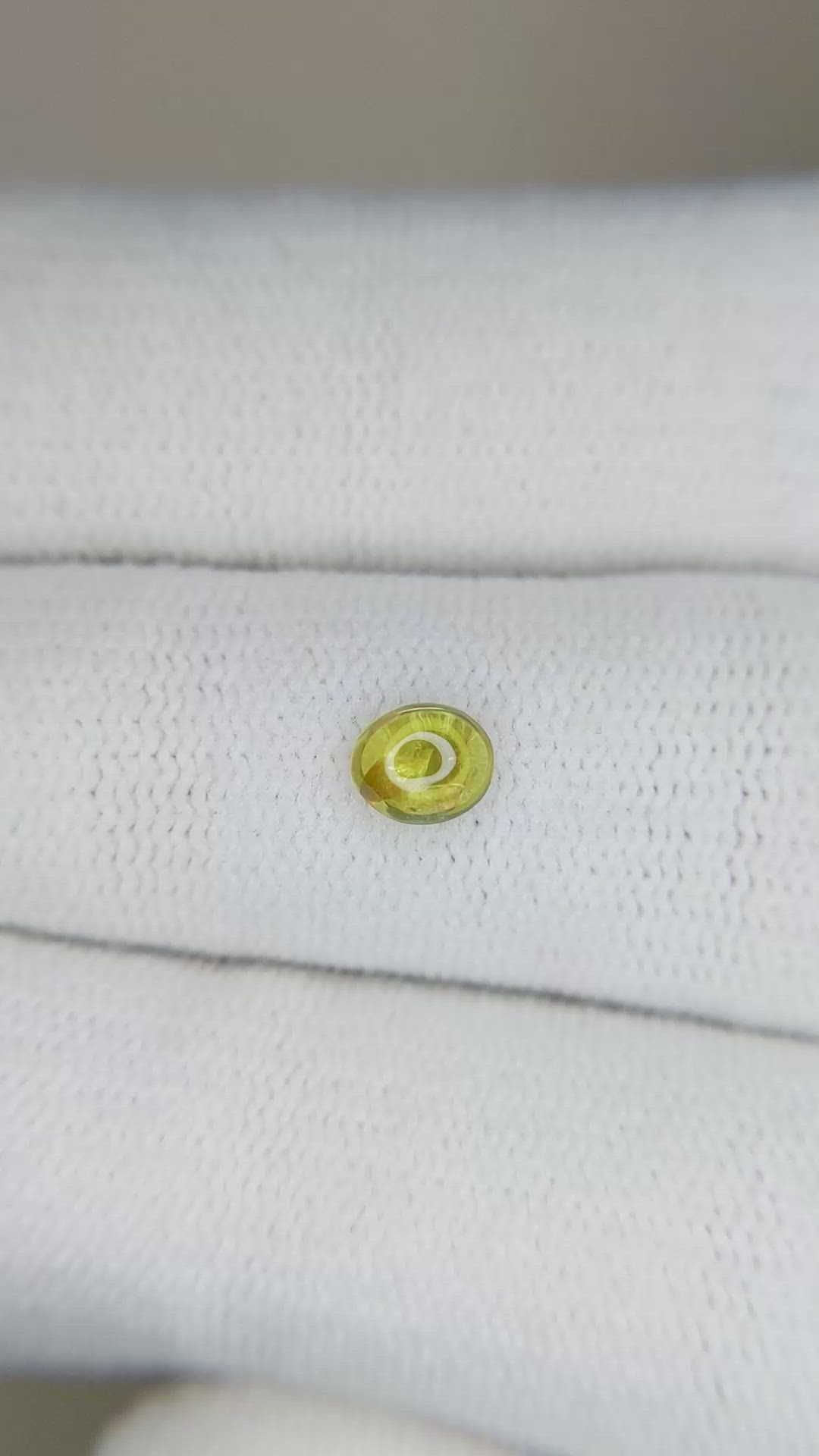 0.45 Ct. Greenish Yellow Cabochon Sapphire from Ceylon (Sri Lanka) Size Video