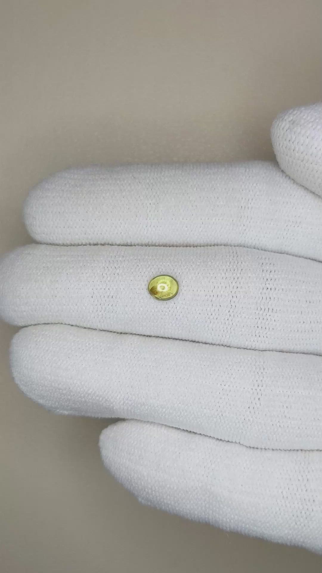 0.45 Ct. Greenish Yellow Cabochon Sapphire from Ceylon (Sri Lanka) Size Video