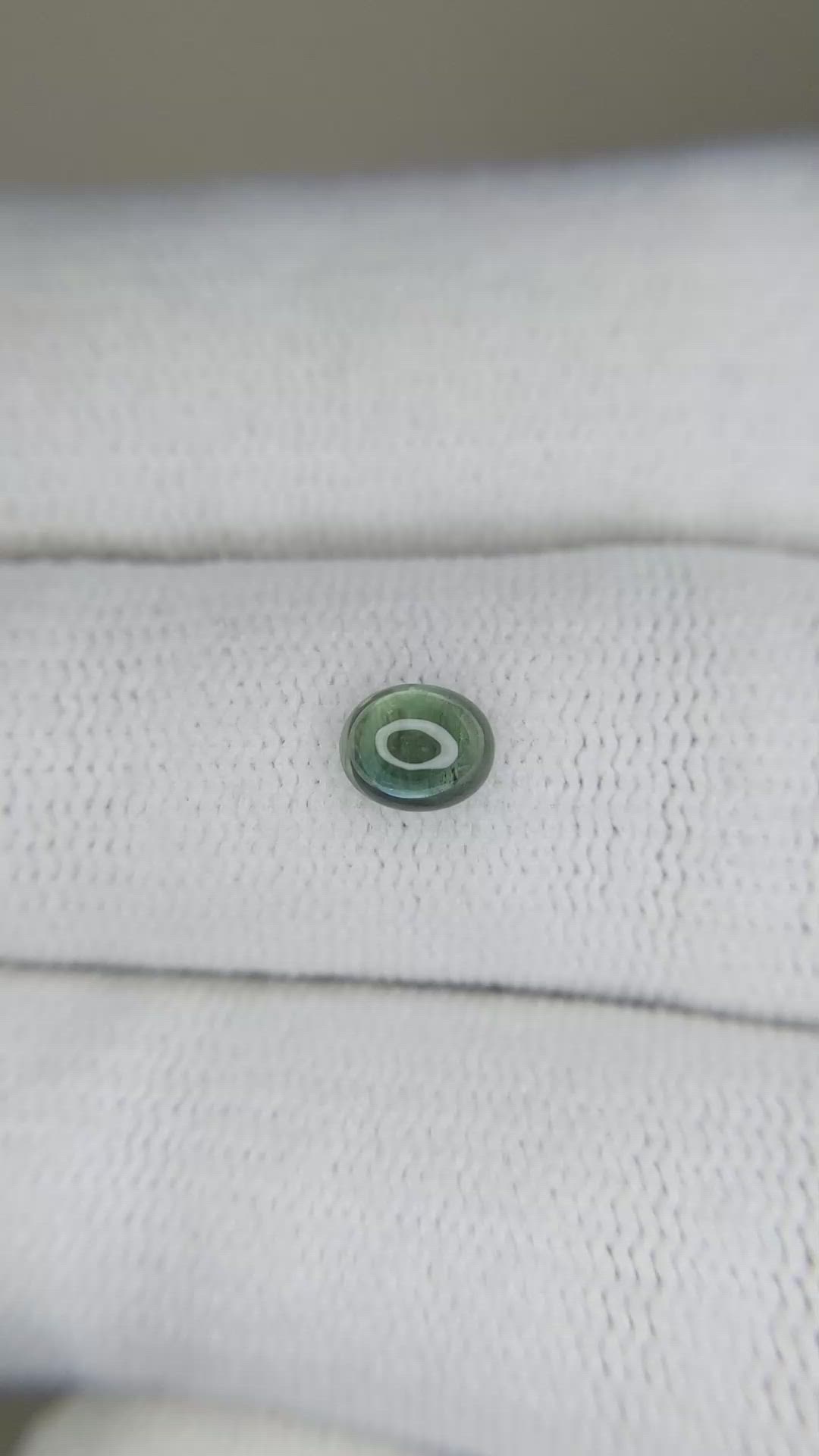 0.59 Ct. Bluish Green Cabochon Sapphire from Ceylon (Sri Lanka) Size Video