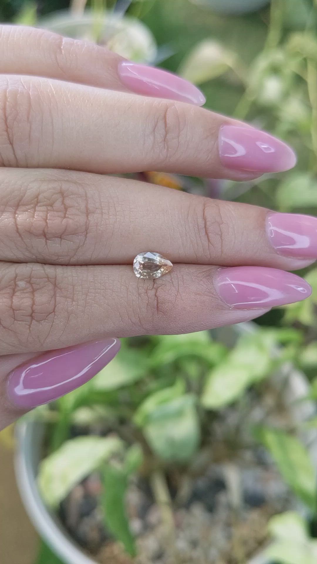 0.67 Ct. Peach Sapphire from Ceylon (Sri Lanka) Size Video