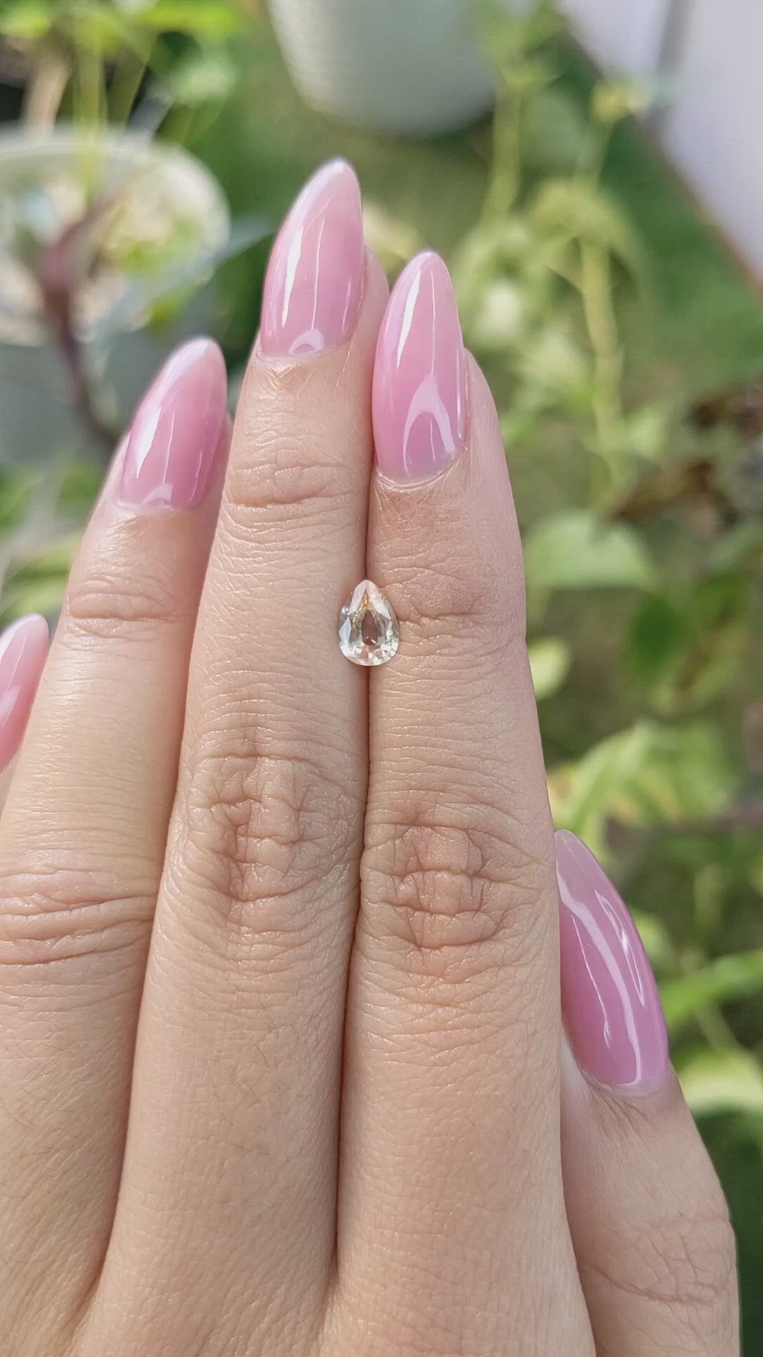 0.67 Ct. Peach Sapphire from Ceylon (Sri Lanka) Size Video