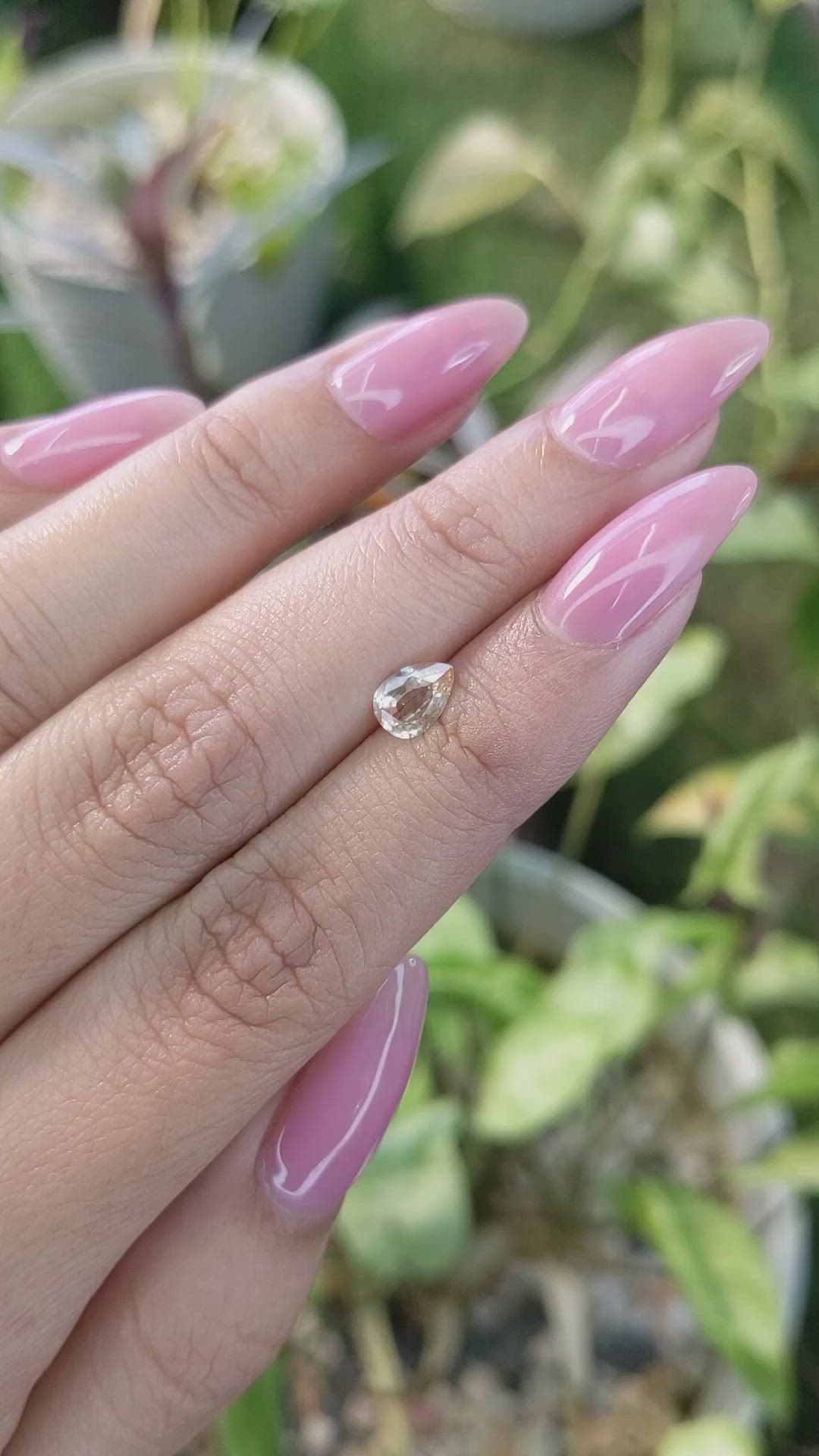 0.67 Ct. Peach Sapphire from Ceylon (Sri Lanka) Size Video