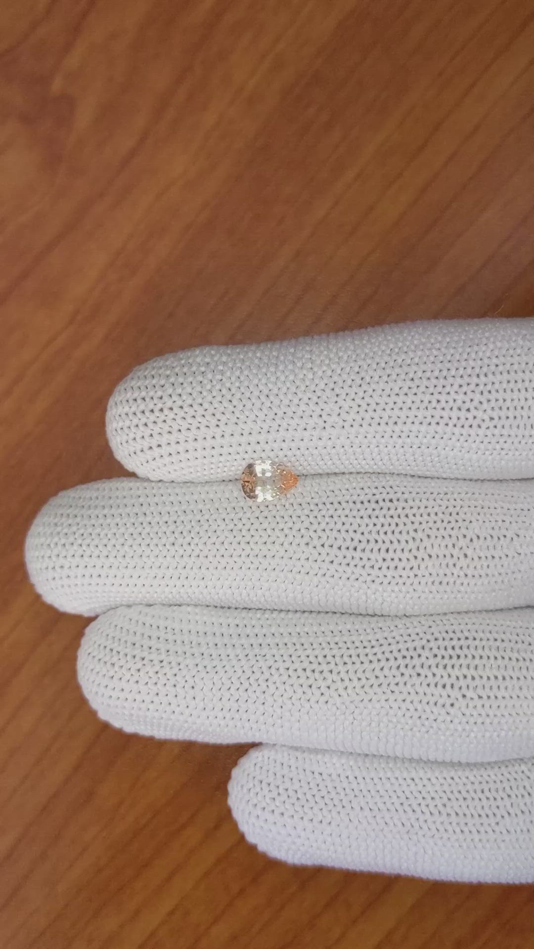 0.67 Ct. Peach Sapphire from Ceylon (Sri Lanka) Size Video