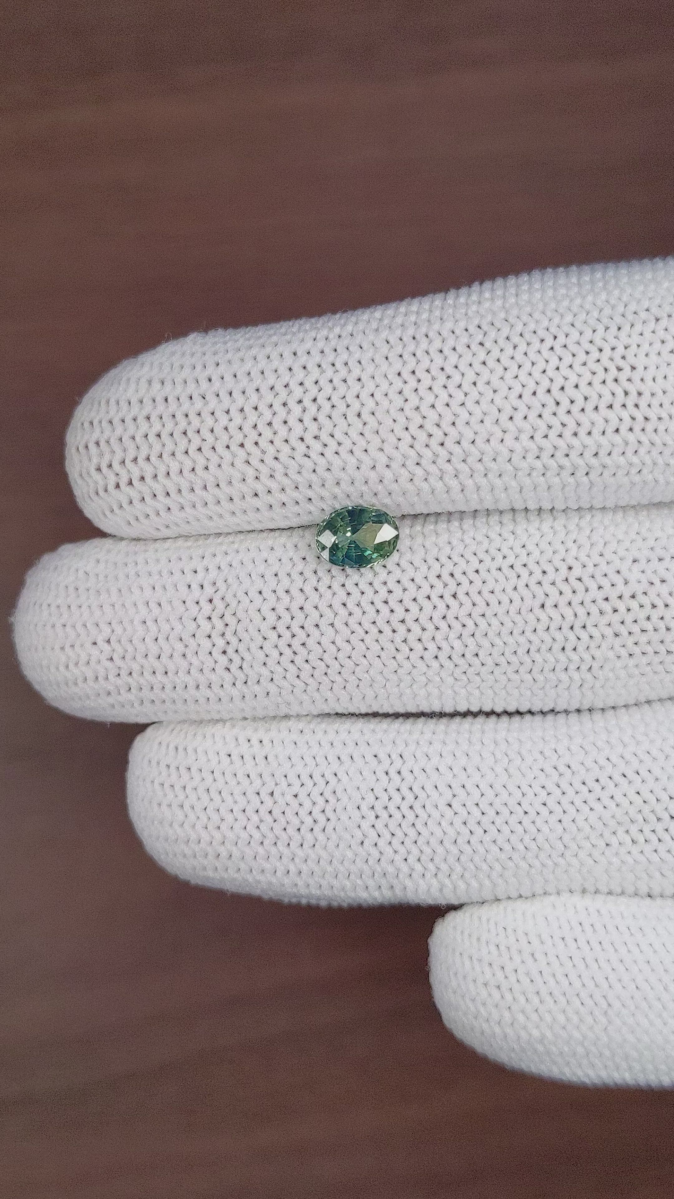 0.98 Ct. Bluish Green Sapphire from Madagascar Size Video