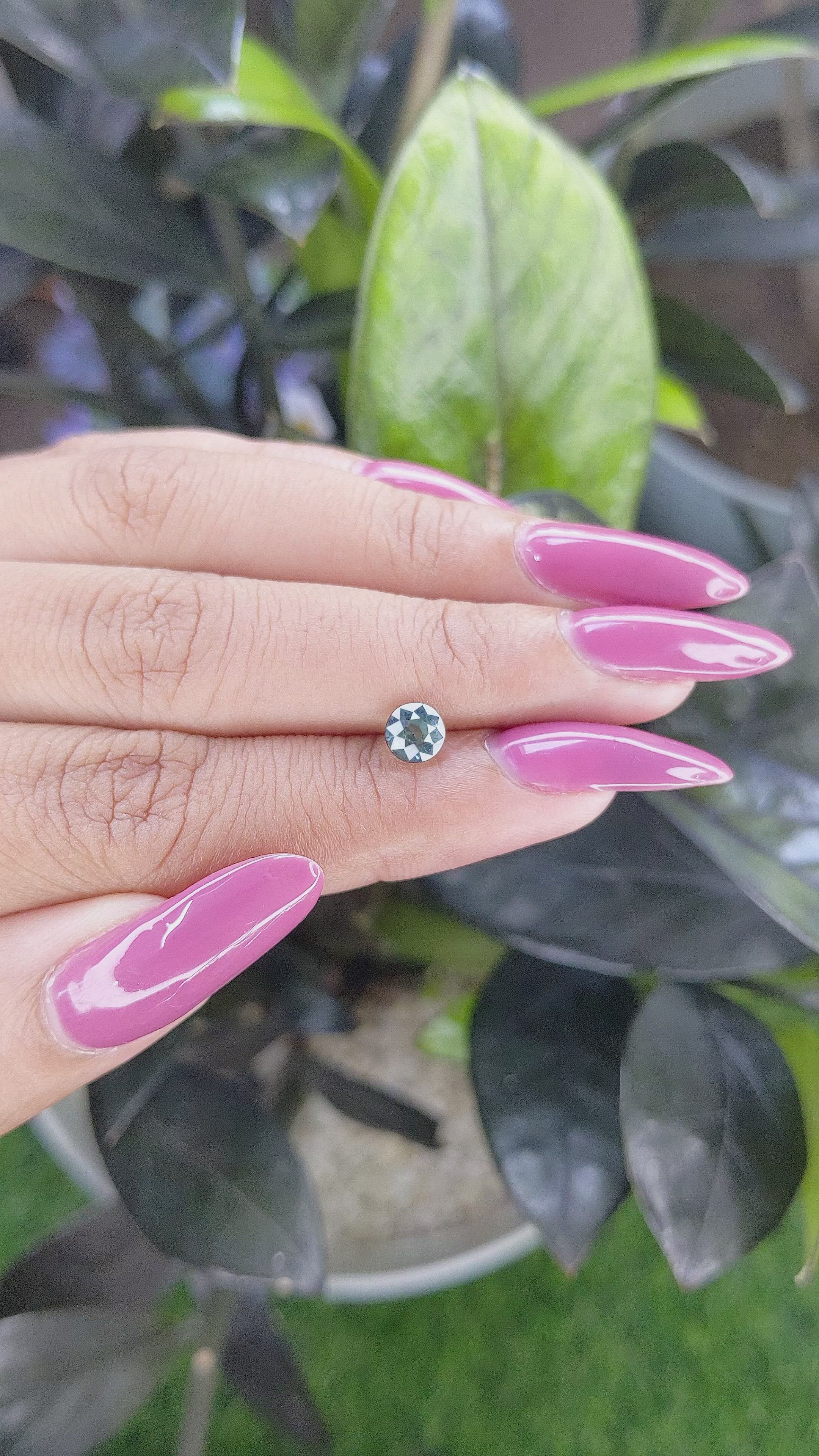 0.94 Ct. Bluish Green Sapphire from Madagascar Size Video