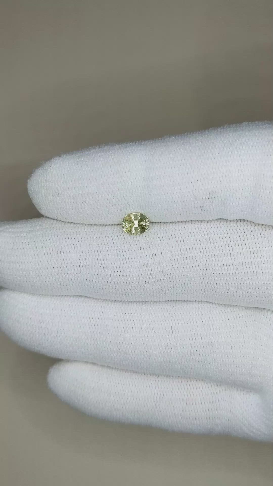 0.68 Ct. Greenish Yellow Sapphire from Madagascar Size Video