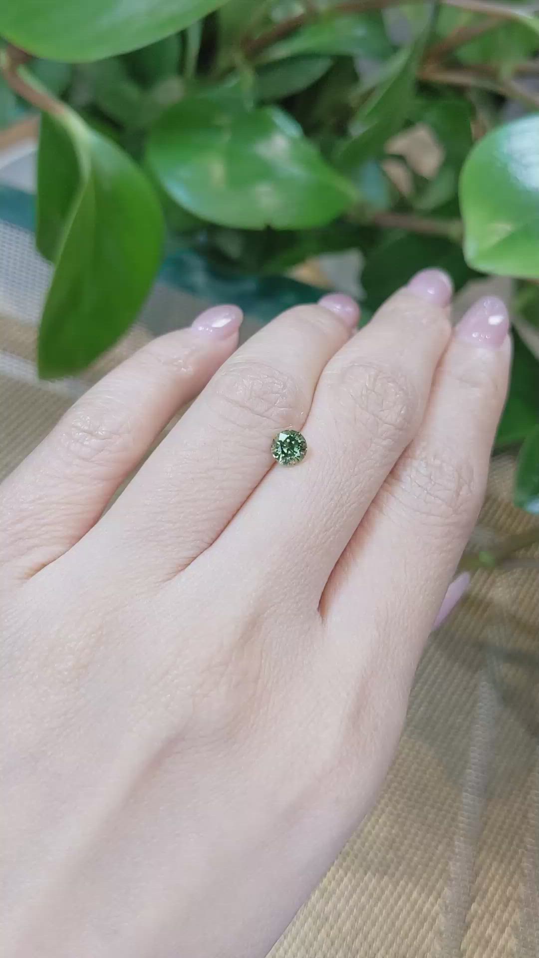 0.68 Ct. Yellowish Green Sapphire from Madagascar Size Video