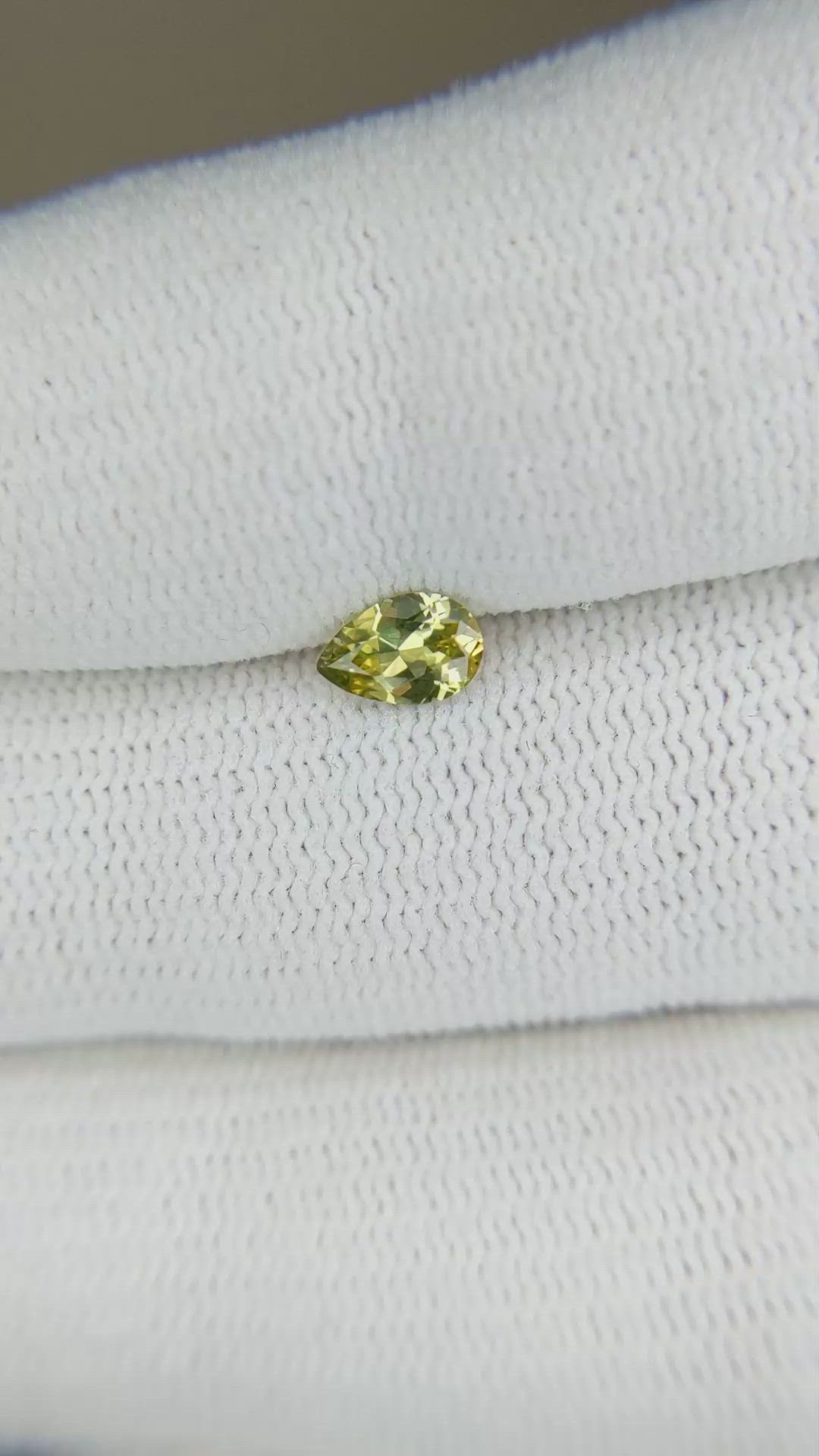 0.39 Ct. Yellowish Green Sapphire from Montana Size Video