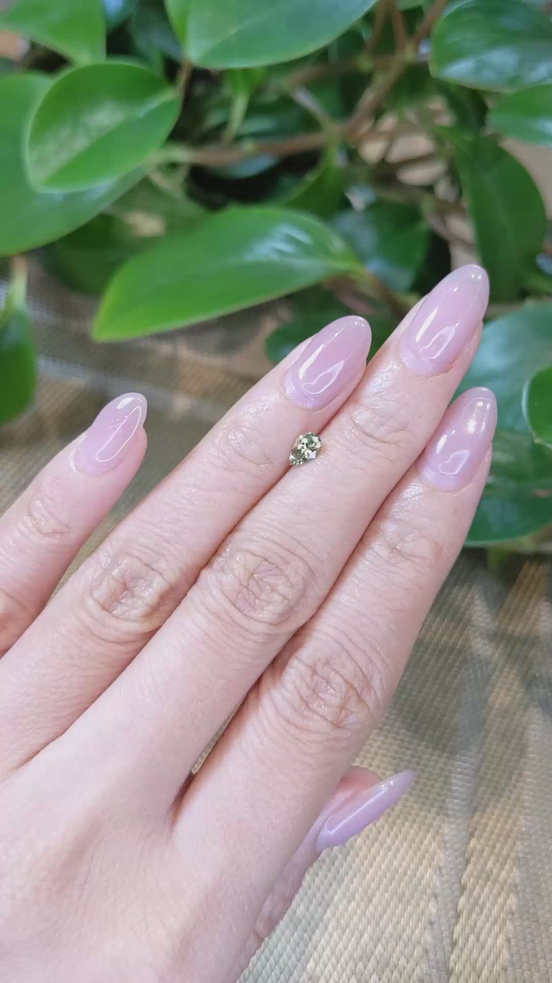 0.44 Ct. Yellowish Green Sapphire from Montana Size Video