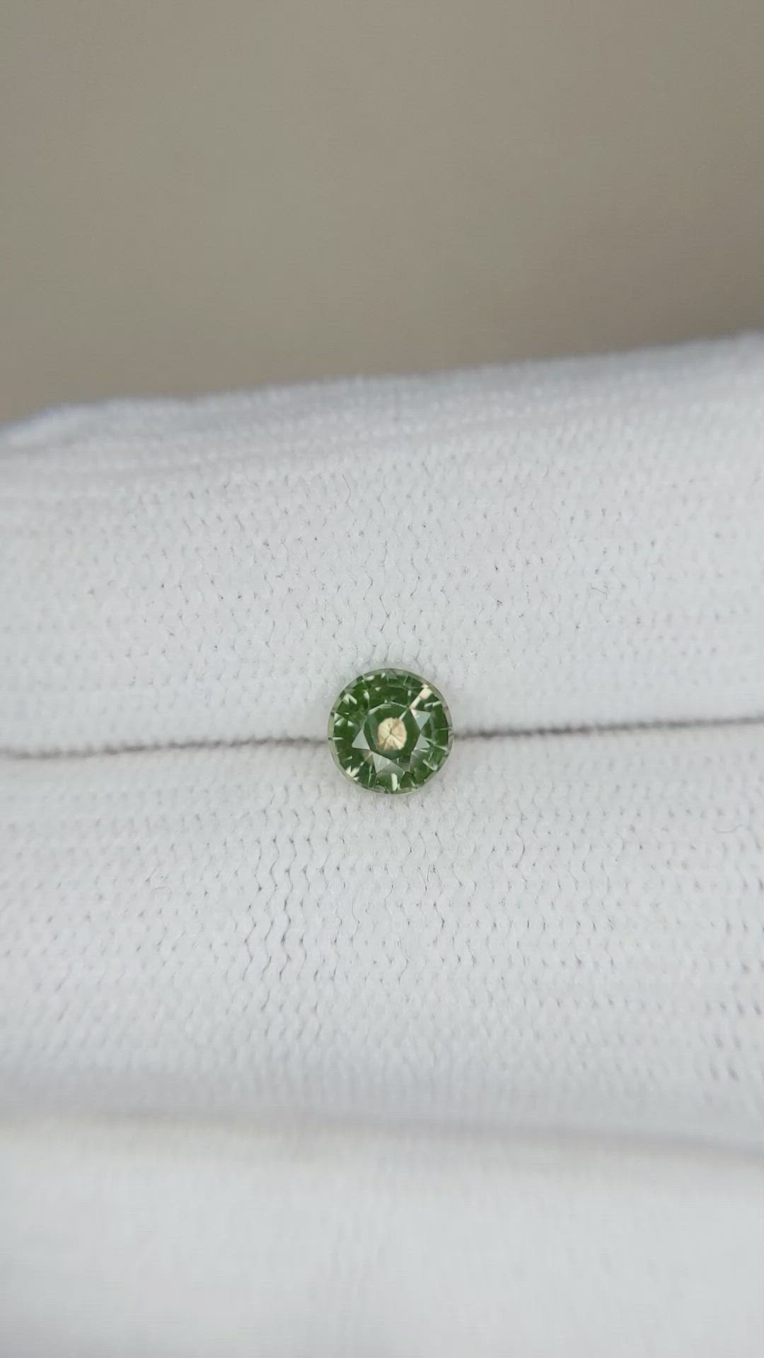 0.64 Ct. Yellowish Green Sapphire from Madagascar Size Video