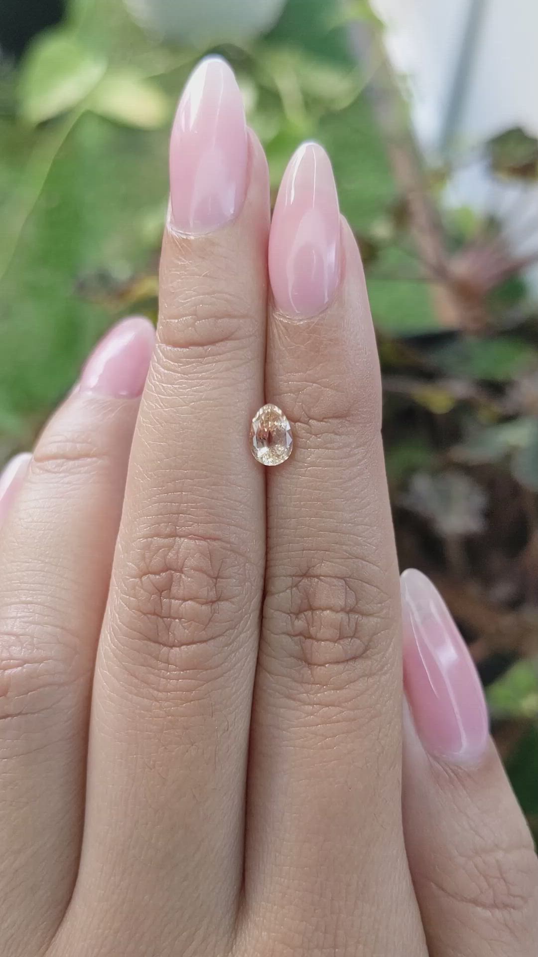 0.96 Ct. Peach Sapphire from Ceylon (Sri Lanka) Size Video