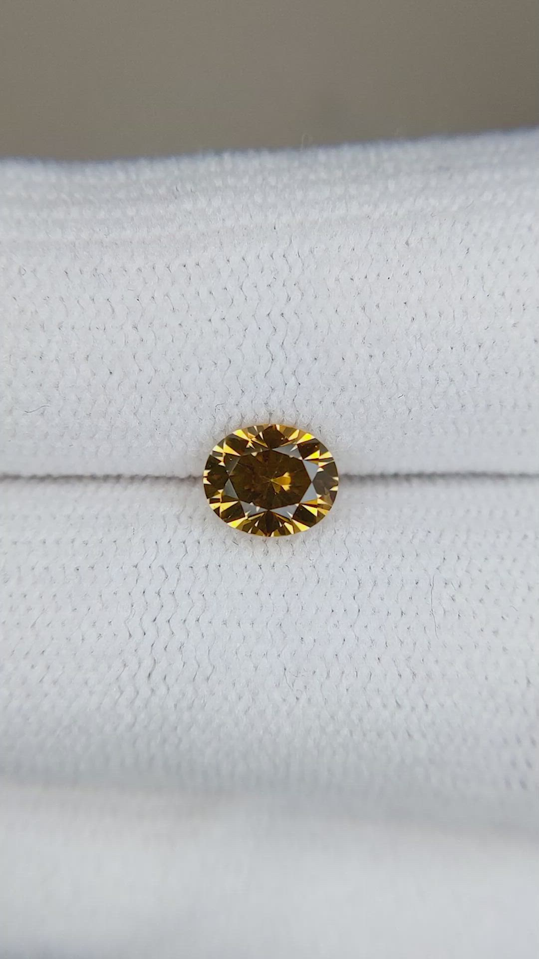 0.89 Ct. Orangish Yellow Sapphire from Montana Size Video