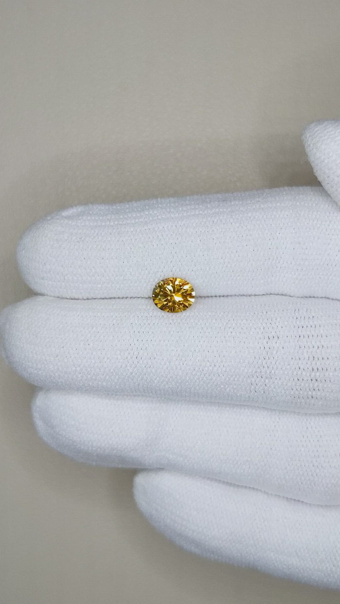 0.89 Ct. Orangish Yellow Sapphire from Montana Size Video