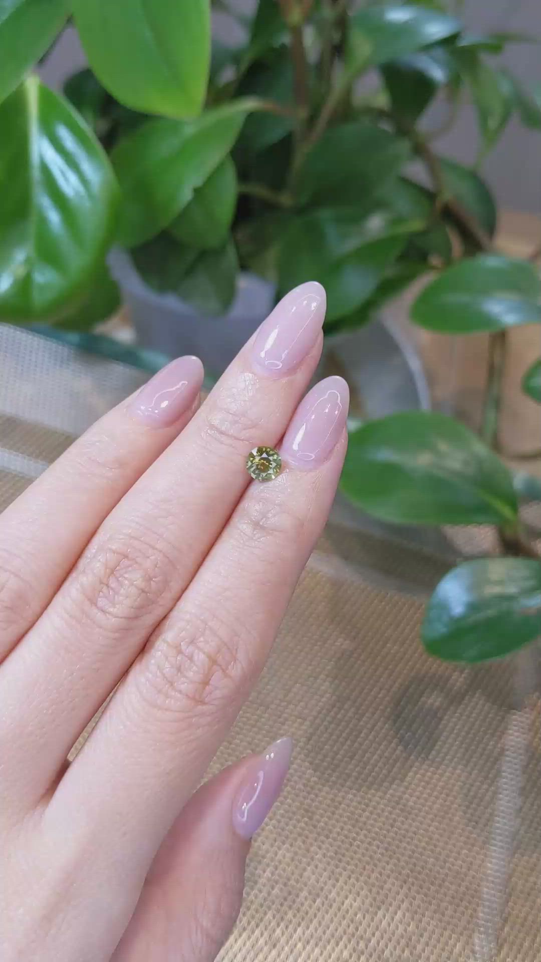 0.79 Ct. Yellowish Green Sapphire from Montana Size Video