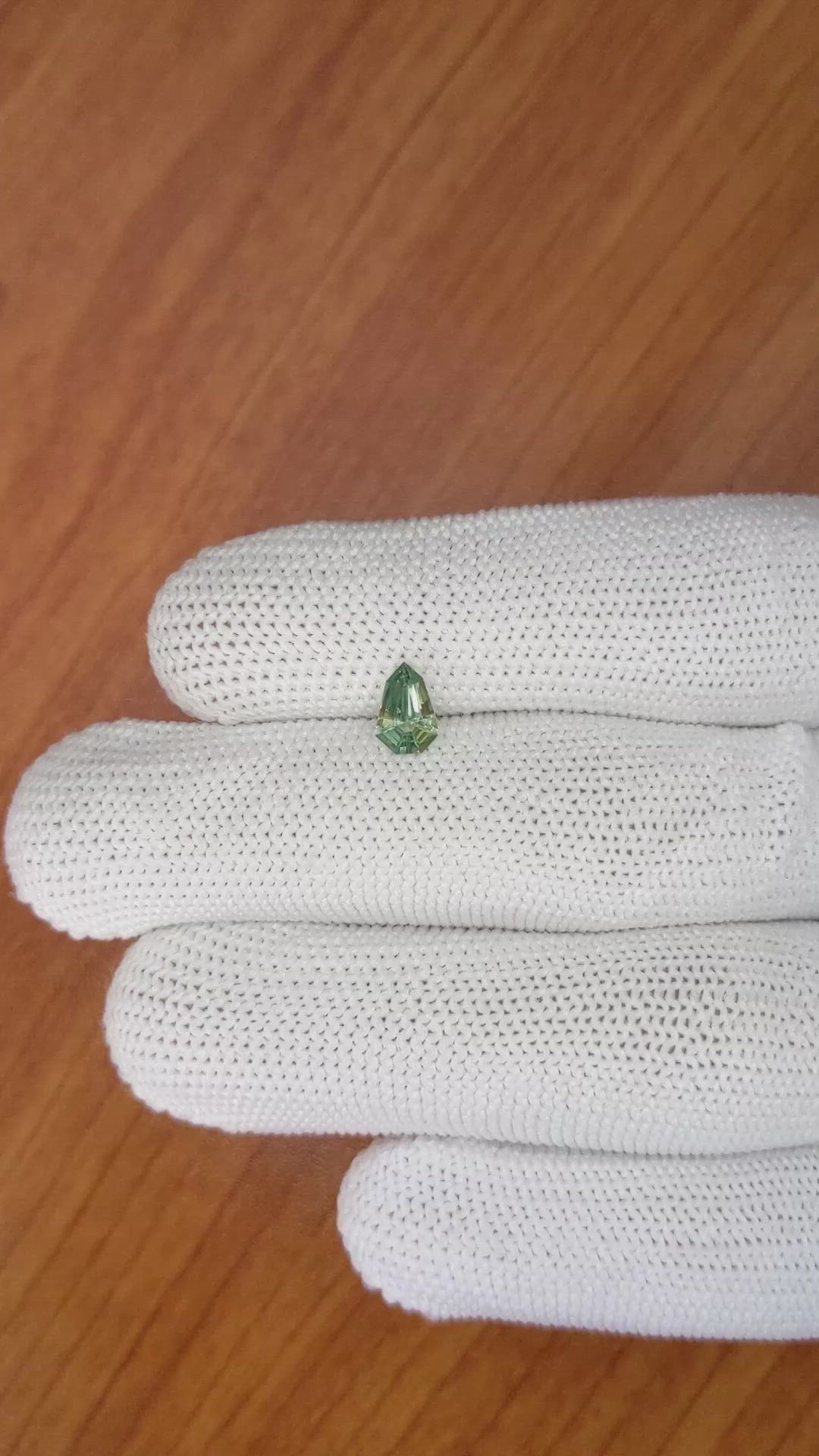 0.72 Ct. Yellowish Green Sapphire from Madagascar Size Video