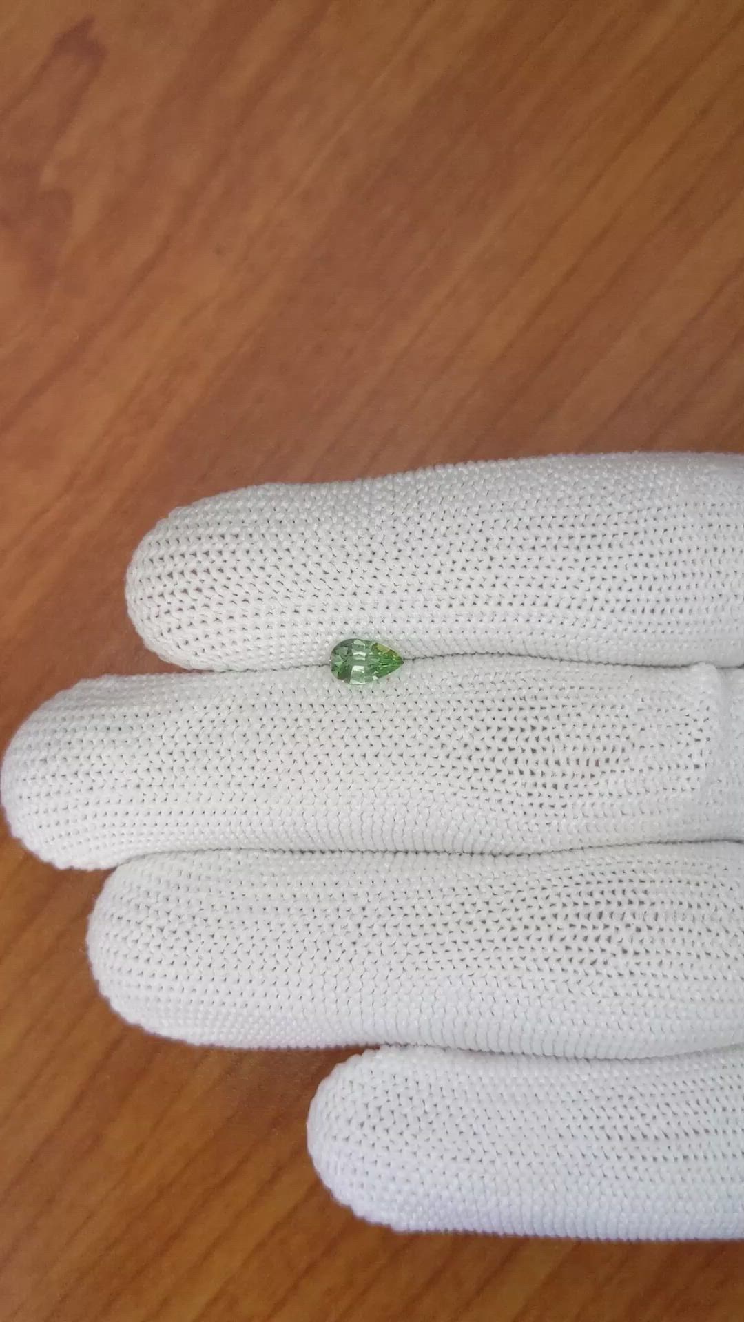 0.52 Ct. Yellowish Green Sapphire from Madagascar Size Video