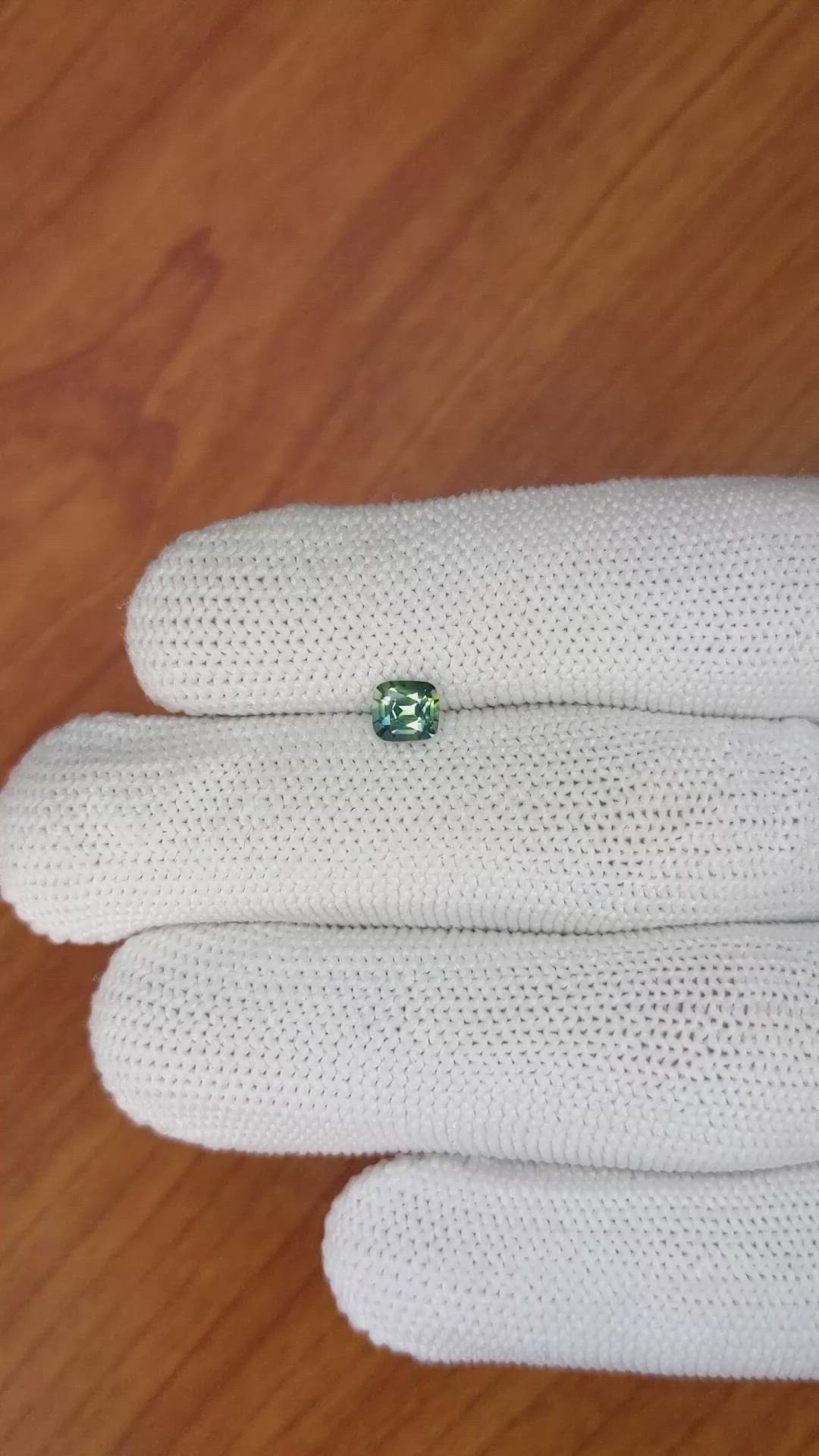 0.58 Ct. Bluish Green Sapphire from Madagascar Size Video