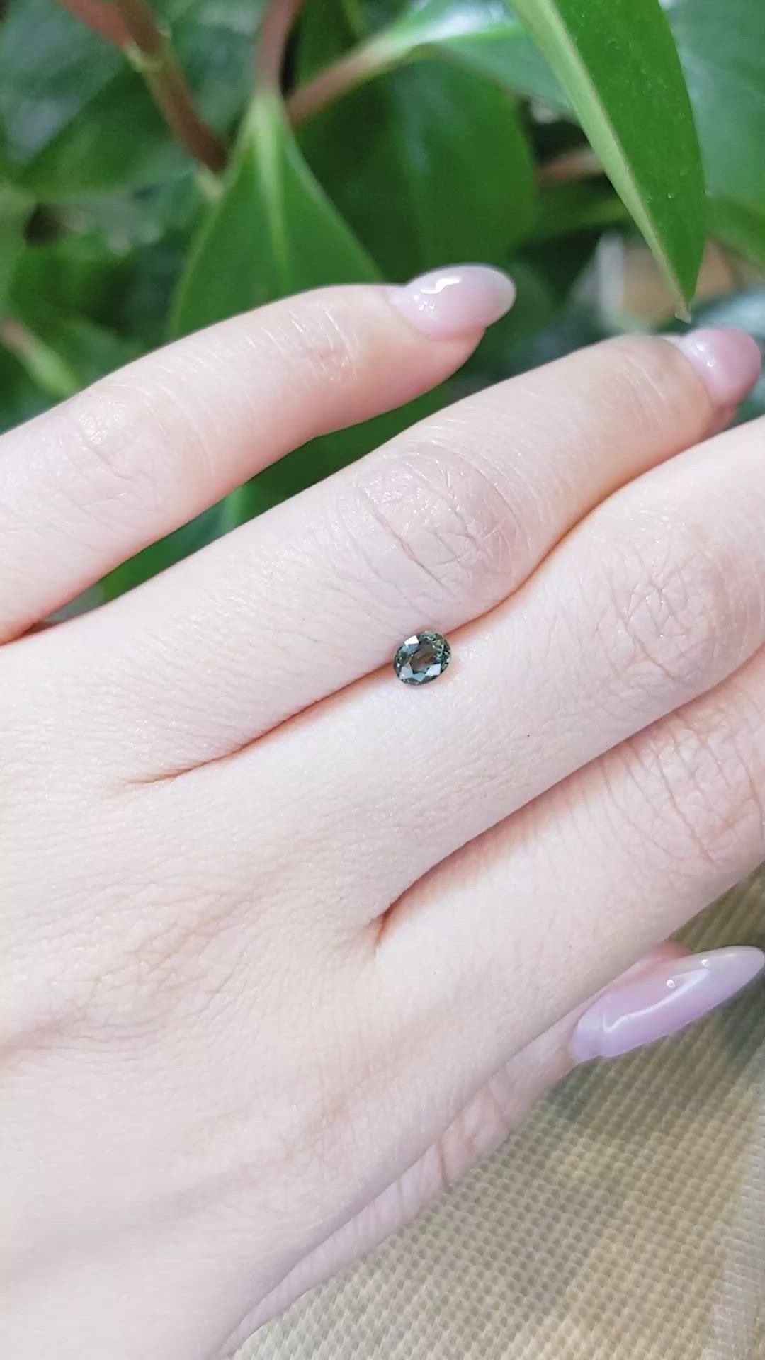 0.39 Ct. Yellowish Green Sapphire from Thailand Size Video