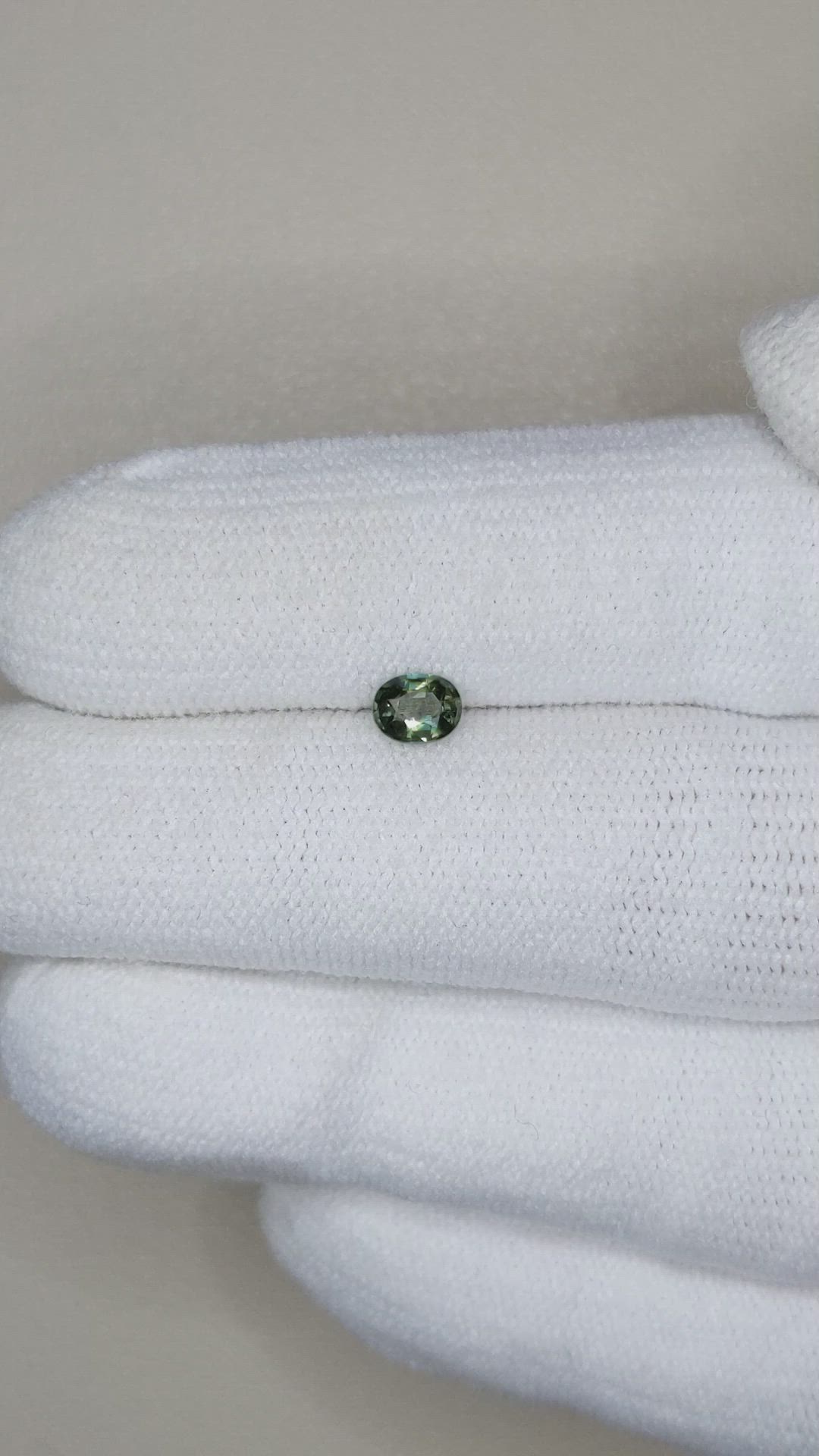 0.39 Ct. Yellowish Green Sapphire from Thailand Size Video