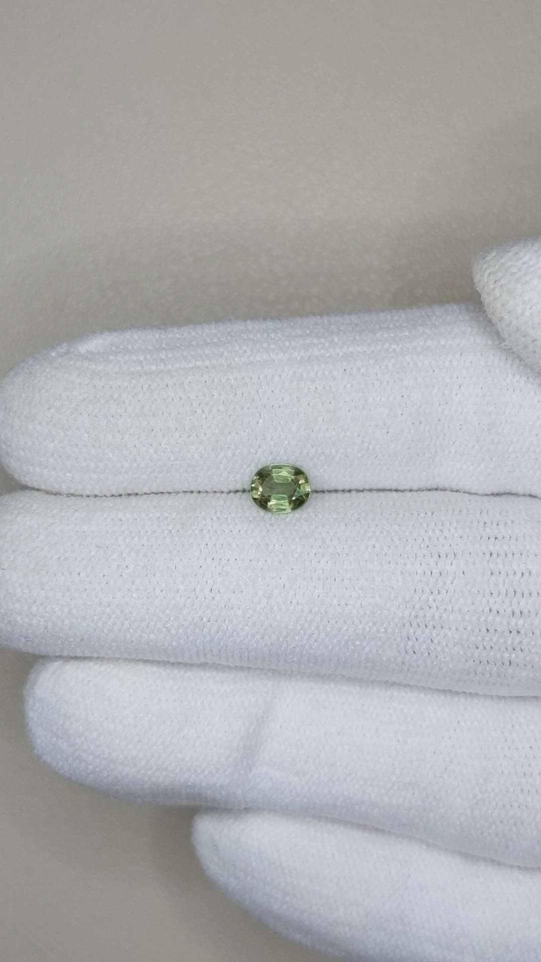 0.47 Ct. Yellowish Green Sapphire from Thailand Size Video