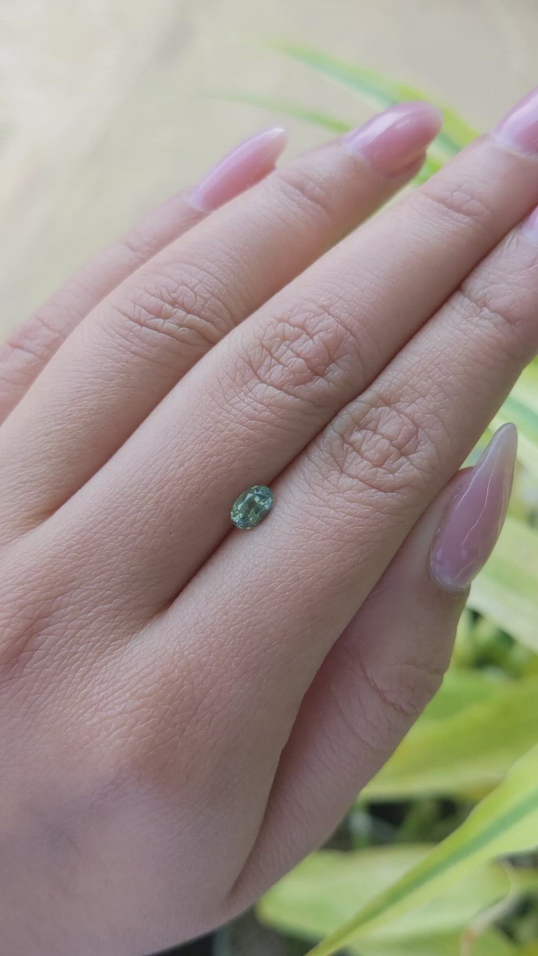 0.61 Ct. Yellowish Green Sapphire from Madagascar Size Video