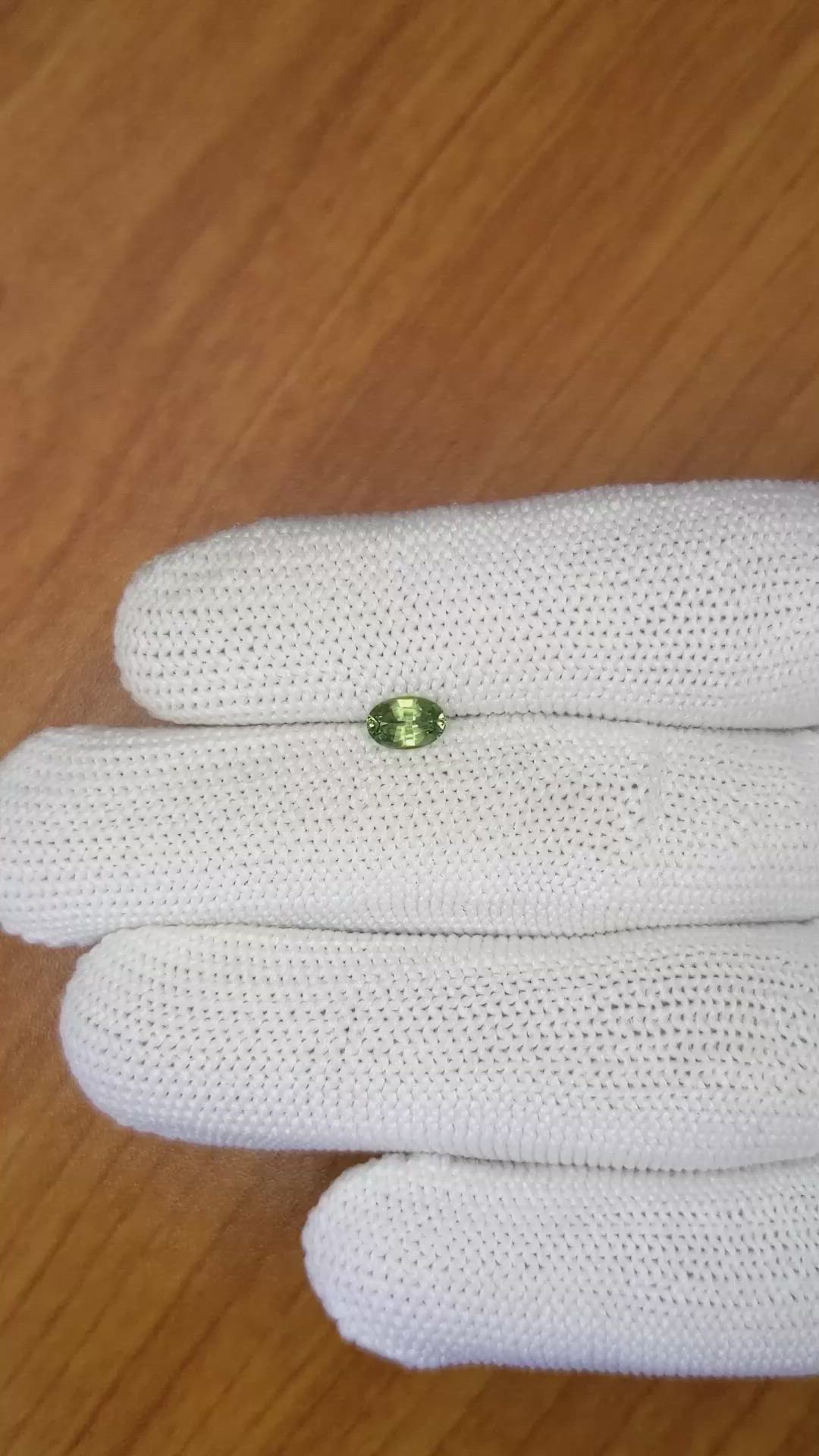 0.61 Ct. Yellowish Green Sapphire from Madagascar Size Video