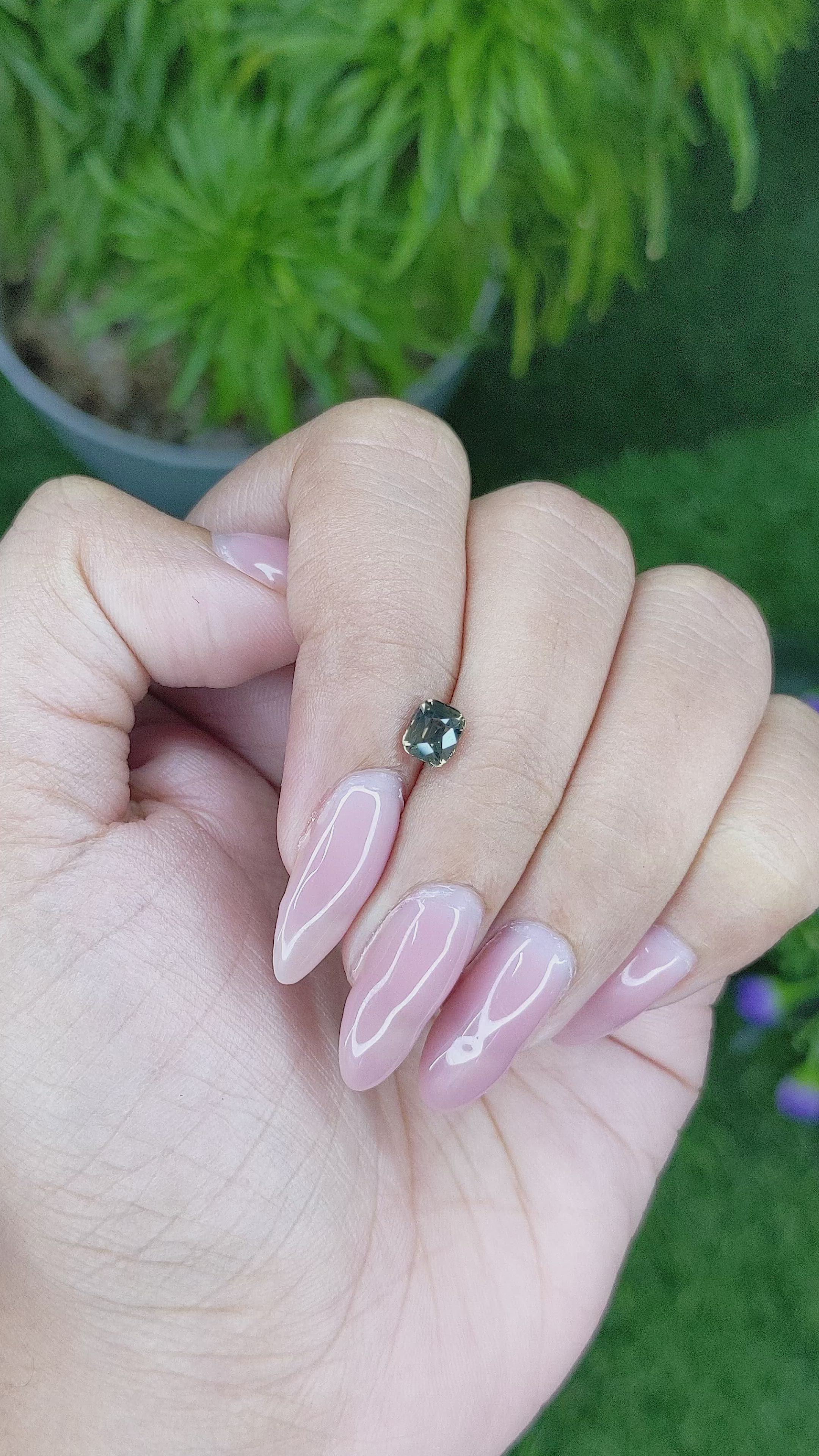 0.88 Ct. Brownish Green Sapphire from Madagascar Size Video